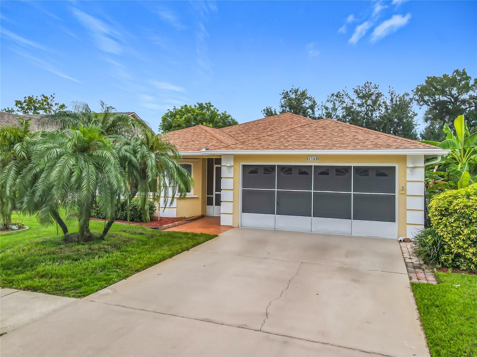 1 OWNER HOME!! This home has not flooded! Beautifully Landscaped front and backyard. Your own private oasis! A lot of the main items have been taken care of. Newer Roof, Complete Air and heat with Air Purifier system done in July 2024. Eat-In kitchen with pass-through to dinning area. New disposal, Microwave and oven/smooth cooktop all replaced July of 2025! Dishwasher done in March 2025. Tiled backsplash, all you need is to make it your own style! Primary bedroom has sliders that lead to Florida room, ensuite bathroom and a 10 x 6.8 walk-in closet! The other 2 bedrooms are far enough away for privacy with guest bathroom. 12x11.2 Family room with French doors that lead into Living and Dining and primary bedroom area already set up with cable for TV, escape and enjoy the wooded landscaped views and a creek that leads out to river using a canoe or kayak. 10x14 patio to cook on grill while taking in these serene private backyard views! Comes with Generac whole house generator. Hurricane Shutters and newer water heater. Inside utility room for laundry, 2 car garage with screen on garage for cool breezes while working in garage. Just a few houses down is clubhouse with community pool and shuffle board courts. Nearby golf courses and you are 2.5 miles from Canal street with great restaurants and specialty shopping. 3.5 miles to River and 5.5 miles to ocean. Idea Location! Quiet neighborhood !