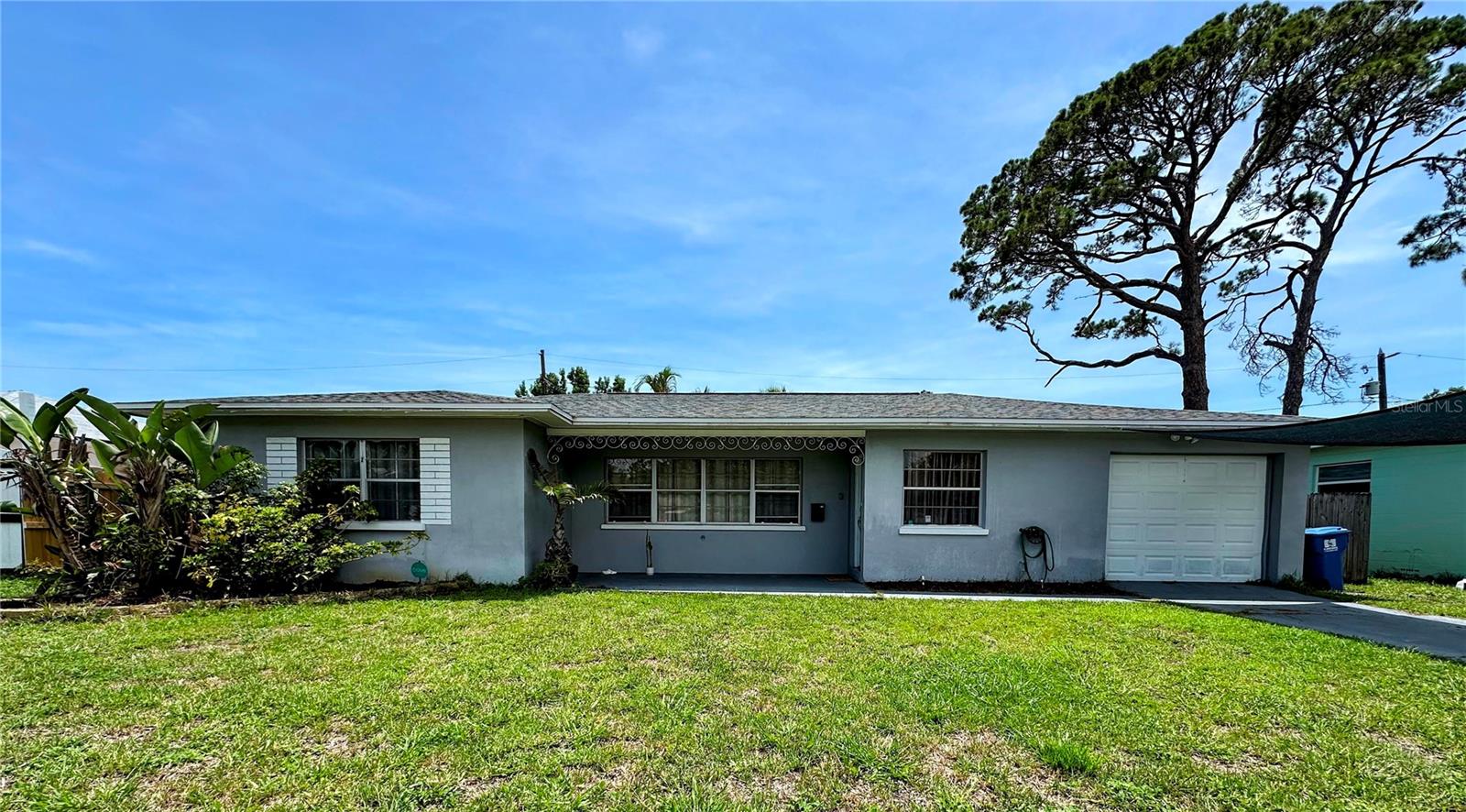 Welcome to this charming 3 bedroom, 2 bathroom home with a 1-car garage, perfectly located in the highly desirable Tyrone Mall area of St. Petersburg. Nestled in the quiet Garden Manor neighborhood, this well-cared-for home blends 1950s Mid-Century charm with modern updates for today’s lifestyle.
Inside, you’ll find plenty of common living space, perfect for entertaining. The spacious, updated kitchen features ample countertop space, plenty of cabinets, and a large pantry. The open-concept living and dining areas create a natural flow that's ideal for everyday living and entertaining.
On one side of the house you will find two bedrooms that share a beautifully renovated bathroom, while the third bedroom—with its own private bath and entrance via the Florida room—is thoughtfully separated from the others, making it perfect for guests, a home office, or studio. The Florida Room offers a bright, airy space perfect for expanding your indoor/outdoor space.
Step outside to enjoy a covered patio, perfect for relaxing or entertaining. The large, fully fenced backyard is ideal for pets, gardening, or outdoor gatherings. A generous storage shed adds even more functionality to this already versatile property.
Additional features include a newer HVAC system (installed in 2022) to keep you comfortable year-round. With a central location just minutes from shopping, dining, and the Gulf beaches, this home truly offers the best of St. Pete living.