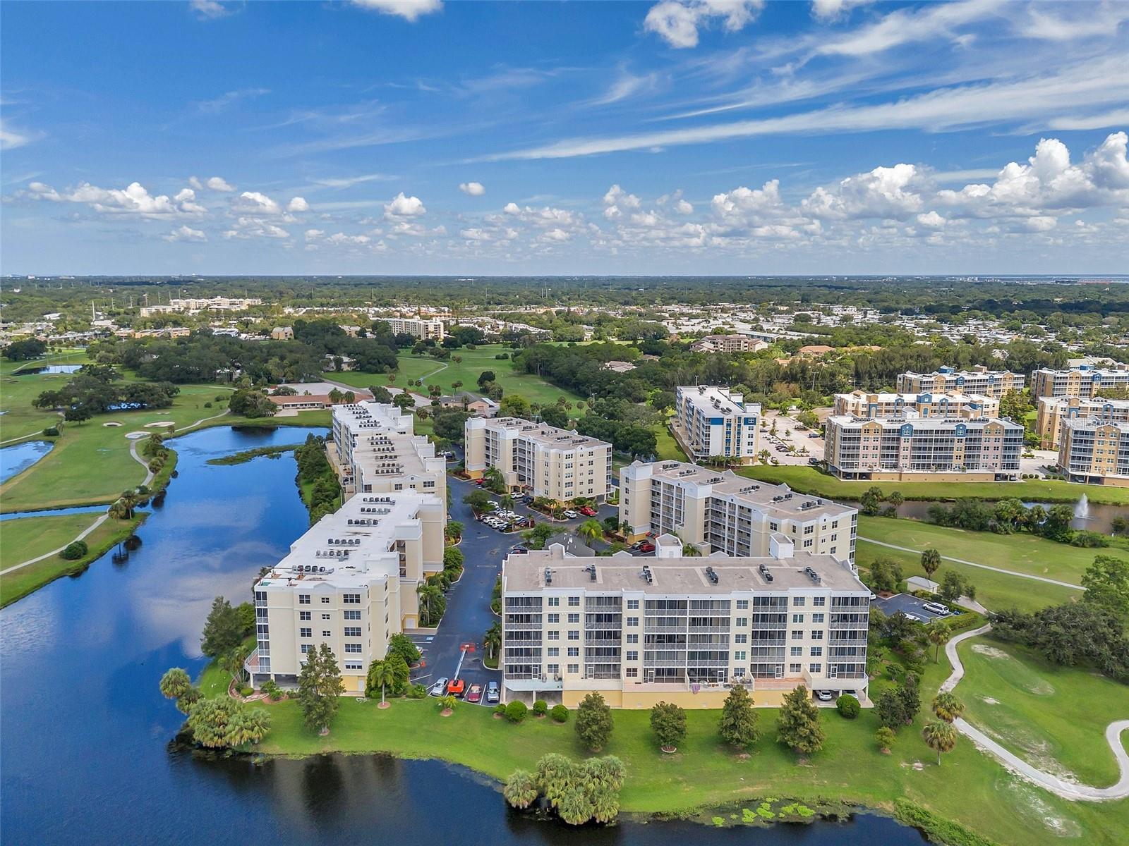 RENT INCLUDES: Cable, Internet, Water & Trash!
This beautifully updated first-floor condo is located along the scenic East Bay Golf Course and offers 3 bedrooms and 2 bathrooms with a spacious, open floor plan. Enjoy views of the fairway and lake from the private terrace, featuring both a screened-in lanai and an additional open-air patio—perfect for relaxing or entertaining. Inside, the unit has been freshly painted and features brand-new stainless steel appliances in the modern kitchen, which also includes a cozy eat-in area. The expansive living and dining space is finished with durable vinyl plank flooring. The primary suite boasts direct access to the terrace, his and hers walk-in closets, dual vanities, and an oversized walk-in shower. The split-bedroom layout offers flexibility, with the second and third bedrooms ideal for guest rooms, a home office, or den. An assigned one-car garage provides convenience and extra storage, and is just steps from the elevator. Resort-style amenities include a heated pool, spa, updated clubhouse with full kitchen, and a private meeting room. This golf course community requires no membership fees and is just minutes from world-class beaches, top restaurants, and an easy commute to downtown Tampa or St. Petersburg.