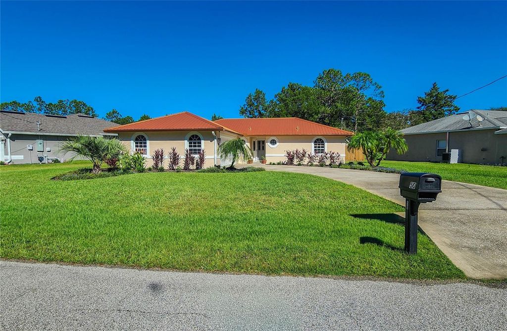 Photo of 50 Whispering Pine Drive, Palm Coast, FL 32164 (MLS # FC313251)