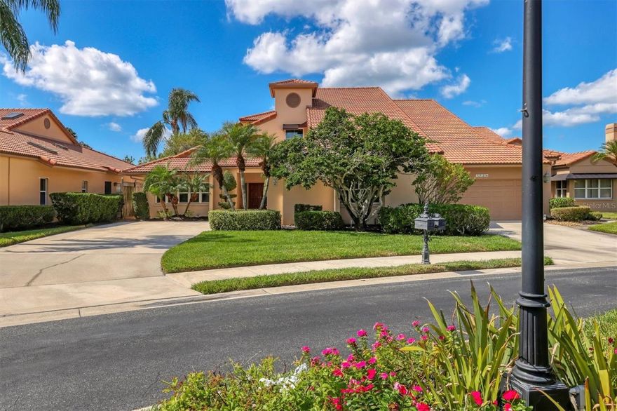 Experience the ease of refined living in this beautiful La Vista single-family villa, nestled within one of Prestancia’s most sought-after maintenance-free enclaves. Perfectly situated within walking distance of the TPC Clubhouse, this residence offers an ideal blend of comfort, elegance, and convenience. Recently refreshed with new interior paint and carpeting, the home exudes understated sophistication and provides an inviting canvas for your personal style. Soaring vaulted ceilings and expansive windows fill the interiors with natural light, creating a warm and open ambiance—ideal for showcasing art and entertaining in effortless style. The spacious living room flows seamlessly to the outdoors through pocketing sliding glass doors that open to an L-shaped covered patio and screened lanai—perfect for enjoying Florida’s signature indoor-outdoor lifestyle.
The thoughtfully designed kitchen features a large center island with seating, abundant counter space, wall oven and microwave with warming drawer, dual sinks, and a charming breakfast nook surrounded by sliding glass doors. A formal dining room offers an elegant space for gatherings and celebrations. The primary suite serves as a tranquil retreat with direct lanai access, plantation shutters, a generous closet, and a spa-inspired bath with dual vanities, a soaking tub, and a glass-enclosed shower. A guest suite with a private bath, a powder room, and a laundry room complete the main level. Upstairs, two additional bedrooms share a full bath—each offering privacy and ample closet space. Hurricane-impact glass throughout provides comfort and peace of mind. The lanai is an outdoor sanctuary featuring both covered and open seating areas, a sparkling solar-heated pool, and serene views that encompass a lush preserve, peaceful water, and TPC Prestancia’s 18th fairway beyond. Residents of Prestancia enjoy 24-hour guard-gated security, beautifully manicured grounds, and the option to join the prestigious TPC Prestancia Golf Club—home to two championship 18-hole courses and a vibrant social community. Ideally located near Siesta Key’s world-renowned beaches, The Legacy Trail, and Sarasota’s acclaimed shopping, dining, and arts scene. Discover the best of Florida living in this lovely home and community—you won’t be disappointed.