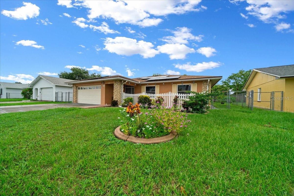 Move-In Ready 4 Bed, 2 Bath Home with 2-Car Garage in the Heart of Orlando! Step into this stunning home loaded with upgrades and packed with charm! The kitchen has been fully renovated with real wood cabinets, granite countertops, and sleek stainless steel appliances. You’ll love the peace of mind that comes with a new roof (2021), impact windows, brand-new A/C (2022), and money-saving solar panels already installed! Enjoy a huge enclosed patio (over 300 sqft!) under A/C—ideal for a family room, game night, or your own entertainment zone. Backyard is a tropical paradise filled with fruit trees galore—mango, banana, papaya, avocado, lime, sour orange, mandarin, and more! Located just minutes from I-4, Publix, Bravo Supermarket, Target, Costco, IKEA, Macy’s, Millenia Park, and great schools—this location truly has it all! Don’t miss your chance to call this vibrant Orlando gem HOME!