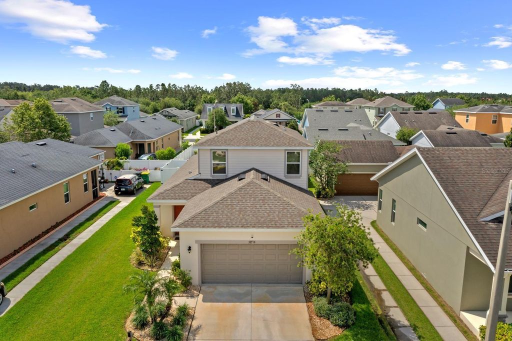 Photo of 32718 Harmony Oaks Drive, Wesley Chapel, FL 33545 (MLS # TB8389166)