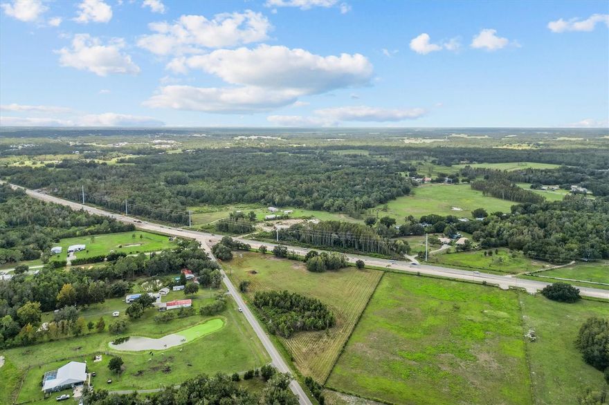 Discover nearly 6 acres of cleared land with direct frontage on US Highway 98 N. This 5.95-acre parcel offers approximately 5 acres zoned residential, providing flexibility for future use or development. The property is ideal for buyers seeking privacy, self-sufficiency, or long-term investment potential. Enjoy the convenience of highway access while still being surrounded by open space and natural Florida scenery. Whether you’re looking to build a private homestead, homes, or hold for future growth, this property presents a rare opportunity at a great value in Polk County.