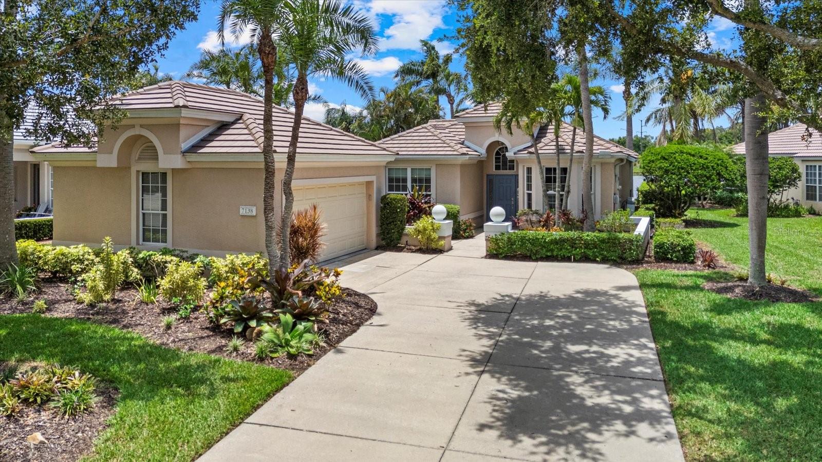 Experience the ultimate Florida lifestyle 2-bedroom plus den home featuring water views in the prestigious University Park Golf & Country Club. This sunny residence boasts a formal entry, soaring volume ceilings throughout, and a beautifully updated kitchen perfect for entertaining. The master suite offers a private sanctuary with en-suite bath and walk-in closet. The second bedroom and versatile den provide flexibility for guests or home office use. Enjoy breathtaking sunset views from the private screened-in patio overlooking the water, creating the perfect setting for relaxation and entertaining. Enhanced by a new roof installed in 2024, featuring a private garage for secure parking and storage. Located in the Notting Hill neighborhood, this home sits within a secure, gated community offering world-class amenities in University Park Golf & Country Club University Park community amenities including 27 holes of championship golf, 11 lighted Har-Tru tennis courts, pickleball, fitness center, first-class dining, lifestyle events and a community pool conveniently located right across the street. This exceptional property delivers resort-style living University Park Golf & Country Club offers several membership options, with a social membership being the minimum requirement. Conveniently located close to Sarasota-Bradenton International Airport, downtown Sarasota and many area pristine beaches.