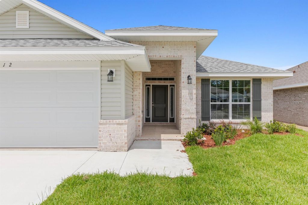 Photo of 15 Roxton Lane, Palm Coast, FL 32164 (MLS # FC314736)