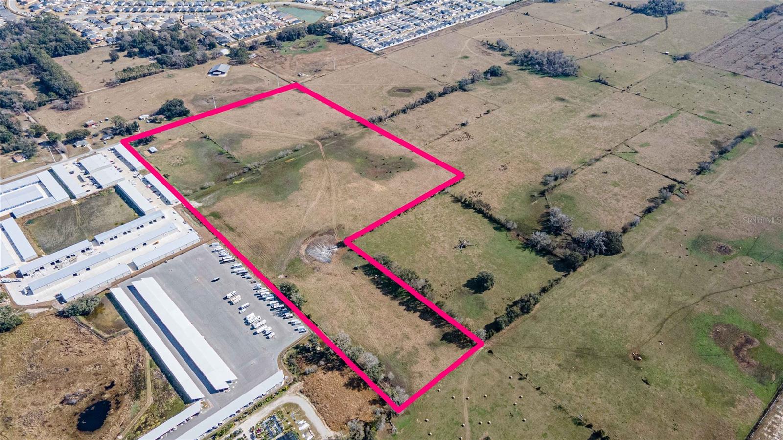 Spanning roughly 35 acres, this property is a dynamic canvas for visionary development. The upcoming re-routing of US Hwy 301 will place prime frontage along its southeast corner, setting the stage for a surge in commercial activity and growth. Surrounded by a vibrant mix of uses—from climate-controlled self-storage and covered RV storage to flexible warehouse space and local churches—and backed by neighboring heavy commercial zoning, the site offers extensive potential for industrial, multi-family, institutional, or commercial ventures. What truly drives its value is the unbeatable proximity, less than 700 feet to The Villages, the nation’s fastest-growing and largest single-site development, paired with the transformative realignment of US Hwy 301. With approximately 990 feet of road frontage on CR 523, the property is mostly high and dry, complete with perimeter fencing and the natural charm of scattered oaks along its northern edge. An existing well is present (pending active status), and water connectivity is readily available through the nearby City of Coleman, enhancing the site's robust infrastructure. Call or Email Today for more information on this amazing site!