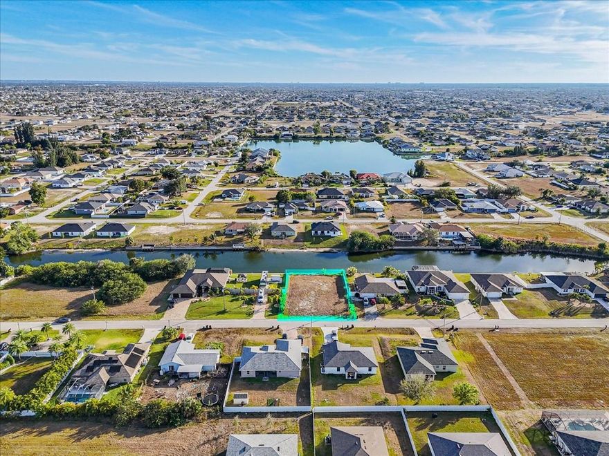 Are you looking for the perfect property to build your Cape Coral waterfront dream home? This slightly oversized southern exposure property offers a brand new seawall and is cleared to save you time. Enjoy watching beautiful sunsets in your backyard! You will enjoy boating through the canals having access to two lakes with two bridges with heights of 7.75' and 9.5'.