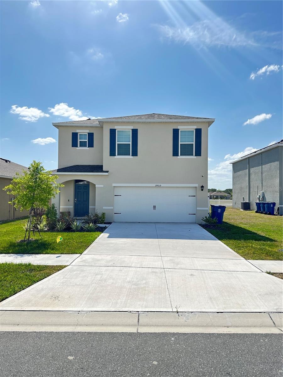 Now available for rent in the desirable Eagle Hammock community of Eagle Lake, Florida! This brand-new 5-bedroom, 3-bathroom single-family home offers 2,447 sq ft of thoughtfully designed living space, perfect for families seeking comfort, style, and functionality. Built in 2024, the home features a bright open floor plan with a spacious living and dining area, and a modern kitchen equipped with stainless steel appliances, granite countertops, and a large island—ideal for cooking and entertaining. One bedroom and a full bathroom are conveniently located on the first floor, providing flexibility for guests or multi-generational living. Upstairs, the primary suite offers a walk-in closet and private en-suite bathroom, along with three additional well-sized bedrooms. For added energy efficiency, the home is equipped with solar panels, helping to reduce utility costs. The fully fenced backyard has been upgraded with a paved patio area, making it perfect for outdoor dining, playtime, or family gatherings. Additional features include a 2-car garage, in-home laundry, and modern finishes throughout. Residents of Eagle Hammock enjoy access to community amenities including a resort-style pool, playgrounds, and scenic walking trails. Conveniently located near shopping centers, parks, and top-rated schools, with quick access to Winter Haven, Lakeland, and I-4. $50 application fee per adult (18+). Don’t miss out on this move-in-ready, energy-efficient rental—schedule your private tour today!
