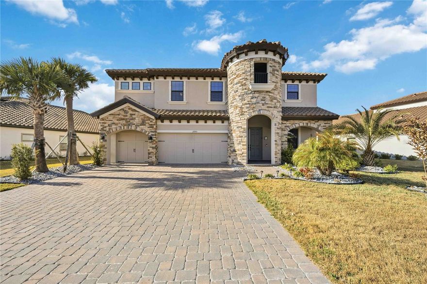 Discover unparalleled luxury in this upgraded Homes by Westbay Verona floor plan. This exquisite single-family residence offers an expansive 3,518 square feet of meticulously designed living space with five bedrooms and four bathrooms. The exterior impresses with its highest-level Tuscan elevation, featuring elegant stucco and stonework, a tile roof, and a spacious three-car garage with epoxy floors and storage cabinets.

Step inside through the double door entry to find a home adorned with the finest finishes & showcasing 10' ceilings. There’s no carpet here—only luxury tile and vinyl plank flooring throughout. The gourmet kitchen is a chef's dream, complete with the extended, upgraded island, additional wall cabinets with a wine refrigerator, and top-of-the-line stainless GE Profile appliances. Cook with ease on the gas cooktop under a vented hood, wall unit oven, & microwave while a glass door walk-in pantry ensures ample storage. Stylish high-level quartz counters and bar seating provides space for entertaining. 

The open-concept great room flows seamlessly to an expansive lanai through an 18-foot sliding glass door, perfect for entertaining or enjoying serene views of the conservation preserve with no neighbors behind. An outdoor kitchen and newly added 40' x 20' lanai extension make it ideal for gatherings or family playtime in a secure environment.

The thoughtfully designed layout includes a downstairs guest room or in-law area with a full bath and lanai access, (which can be a pool bath for future pool) providing privacy and convenience for extended family or visitors. Upstairs, boasting 9' ceilings, the primary suite offers a sanctuary with its double door entry, abundant natural light, and a luxurious en-suite bath featuring separate vanities, a soaking tub, a rain shower, and a spacious walk-in closet. Each bedroom is equipped with a walk-in closet, ensuring ample storage for all.

Additional upstairs features include a large laundry room with a sink and included washer and dryer, a guest room with a full hall bath, and two bedrooms (one with a window seat) sharing a Jack-and-Jill bathroom. The generous bonus room completes the upper level, providing flexibility for entertainment, relaxation or study/play space. 

This home is situated in a community that enhances your lifestyle with low HOA fees covering a new pool, cabana, parks, pickleball, playground, walking trails and more. Nestled in a quiet neighborhood, yet conveniently close to Parrish amenities, newer schools, retail, restaurants and medical facilities (2 new hospitals under construction), this property offers both tranquility and accessibility.

Experience the elegance and comfort of this upscale home. Schedule a showing to experience it in person.