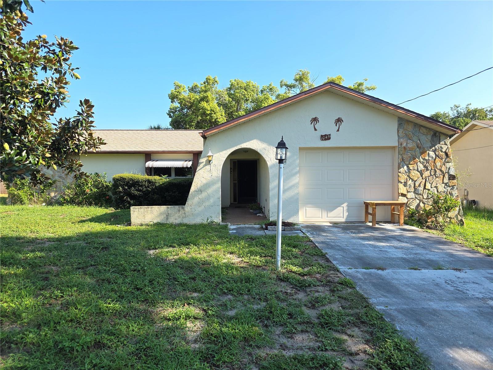 Spring Hill 2 Bedroom 2 Bath Home With A Oversize Garage 23x15- Enter The Home To A Tile Foyer- Coat Closet- Tiled Living Room And Dining Room Plus A Family Room- The Primary Bedroom Has A Walk In Closet And Private Bathroom With A Walk In Shower- Oversize Lanai And A Shed In The Back Yard-- Extras Include New Roof 2021, Newer Windows And Slider And Garage Service Door, Septic Recently Pumped Out, Open Floor Plan Call Today For A Showing.