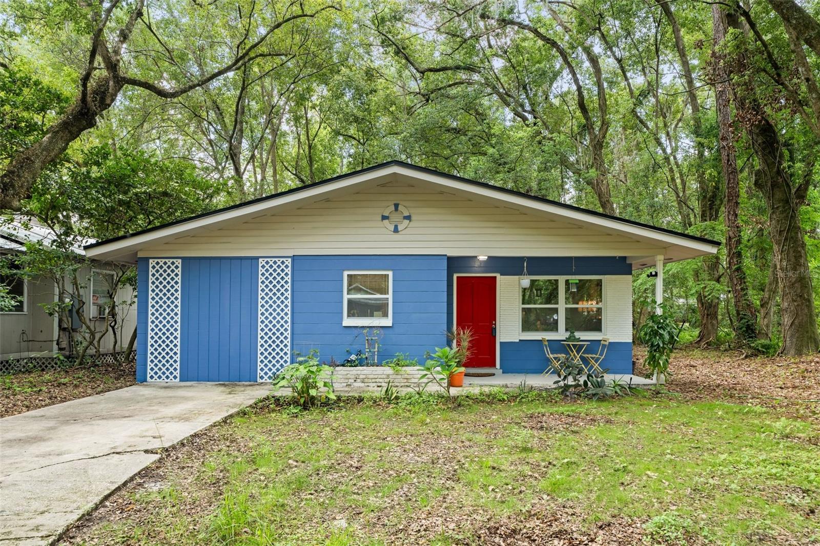 Welcome to this charming 3 bedroom home in the heart of northeast Gainesville! Thoughtfully updated and well cared for, this home features durable vinyl plank flooring and ceiling fans throughout. The kitchen is equipped with attractive counters and the washer and dryer are staying for added convenience. Major upgrades give peace of mind, with a 2021 roof, a 2023 Trane HVAC system, and a water heater that’s only three years old. The yard has been improved with cleared trees and new fruit plantings including orange, peach, banana, and lemon trees—perfect for those who love a touch of homegrown goodness. Blinds and curtains are already in place, adding to the move-in-ready feel of this lovely home within biking distance to the University of Florida!