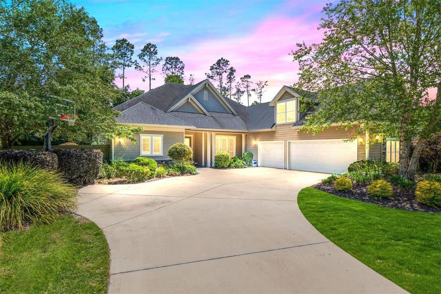 Exceptionally built, an exceptional location and an exceptional floor plan! This Mark Warring built home in the Estates of Wilds Plantation is situated on a rarely available south-facing lot, which maximizes sunlight exposure. This popular floor plan features 4 bedrooms plus bonus room/5th bedroom home and 4 baths. Rich engineered hardwood flooring connects all of the downstairs living spaces. The separate dining room, great room, kitchen and nook have an easy flow, perfect for daily living or for casual entertaining. The wood beam vaulted ceiling gives the family room its spacious feel. The focal point is the wood ship lap wall with its modern aesthetic for your TV and gas fireplace. Floating shelves are to the right, and the entire wall has an elevated tiled hearth. Open the telescoping sliding glass doors to access your paver lanai, pool and summer kitchen area. The stunning kitchen has hand-crafted wood cabinetry and neutral granite counters. On each side of the exhaust hood are display cabinetry with glass inserts. Add’l features include a convection wall oven and separate microwave, a gas cooktop, double door pantry, a custom backsplash and a functional one-level center island countertop. The nook has a single French door for lanai and summer kitchen access. Via the nook are 2 guest rooms, each with double door closets, and a full guest bath. Off the opposite end of the kitchen is the en suite guest bedroom. This 4-way split plan offers the master suite and bath occupying the entire left wing of the home. Best features include south-facing windows of the lanai and pool and a step-up tray ceiling accented with natural wood beams. The hallway to the bath has his-and-her walk-in closets, each with organizational systems, and a hallway dressing mirror. The master bath features handcrafted floating cabinetry, neutral granite counters, a soaking tub with a custom tile wall and shelving flanking each side, and a separate water closet and step-in shower. The staircase for the bonus room/5th bedroom is located in the clutter hallway near the laundry room hallway. The upstairs landing as a direct attic access door and a storage closet. Spanning the width of the 3CG below with 528SF, the bonus room/5th bedroom features a double door entry, built-in shelving and a full guest bath. Downstairs the concrete paver lanai can be accessed via the nook or great room. The summer kitchen has a built-in grill with exhaust hood. The pool, its solar panels, and screen enclosure were added in 2017. The pool is perfect for swimming laps and for fun and play. The screen enclosure was specially engineered for “picture” screening for uninterrupted views of the rear yard on all 3 sides. Additional home features include 30-year architectural shingle roof, irrigation system, laundry room with sink and upper and lower cabinets for storage, Plantation shutters, Leviton WiFi enabled lighting system with dimming feature, alarm system, tankless gas WH, and a zoned high efficiency HVAC system. Walk, ride your bike or drive to the nearby local and private schools. Publix, several restaurants and local shops in the Haile Market Square, only 4 min away.