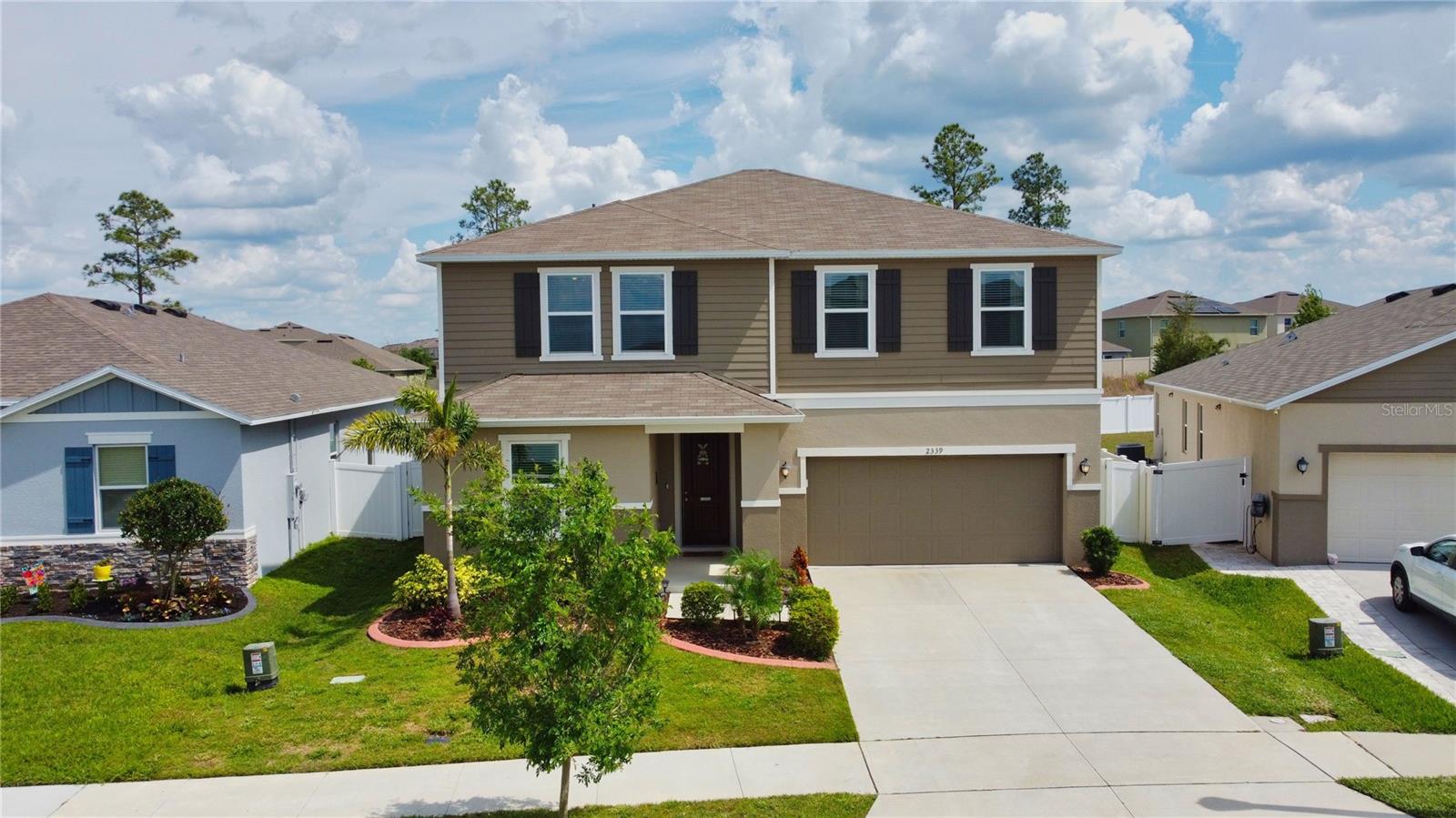 This spacious, move-in ready 4 bedroom, 3 bathroom + loft home is only 20 minutes from Disney. This home was built in 2021 and has been extremely well taken care of. The kitchen is open, featuring stainless steel appliances with stunning granite countertops. This cozy home offers crown molding throughout. The guest bedroom and a full bath are conveniently located on the first floor. In the backyard, you’ll find a nicely screened-in patio and a large fenced-in yard. This home is dream worthy, located in a quiet, safe neighborhood with a clean community pool and play area. Nearby, you’ll find great schools and shopping plazas; this home will check off all of your boxes.
