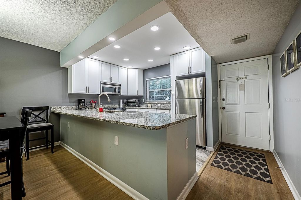 Photo of 10215 Regal Drive #14, Largo, FL 33774 (MLS # TB8426965)