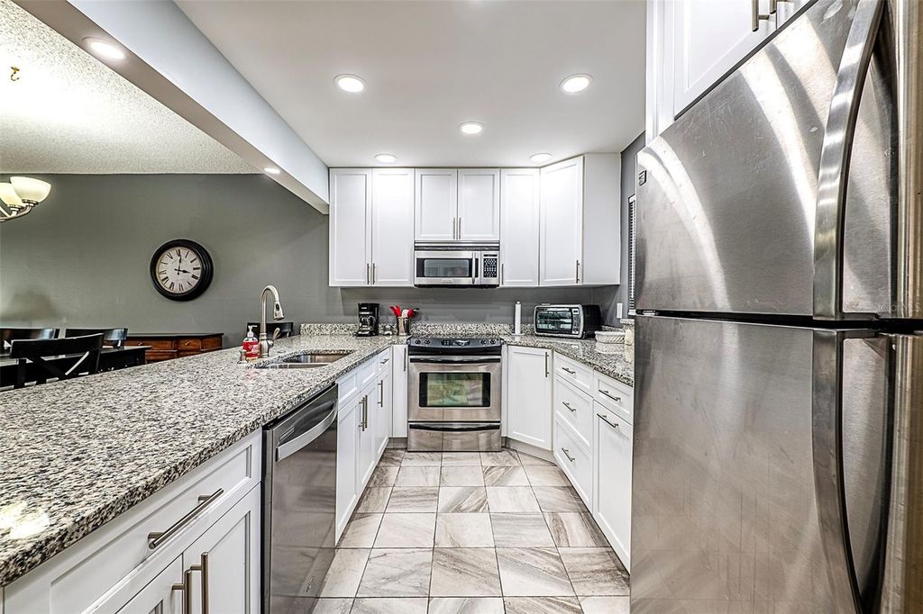 Photo of 10215 Regal Drive #14, Largo, FL 33774 (MLS # TB8426965)