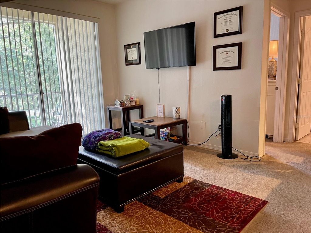 Photo of 2627 Maitland Crossing Way #205, Orlando, FL 32810 (MLS # O6389296)