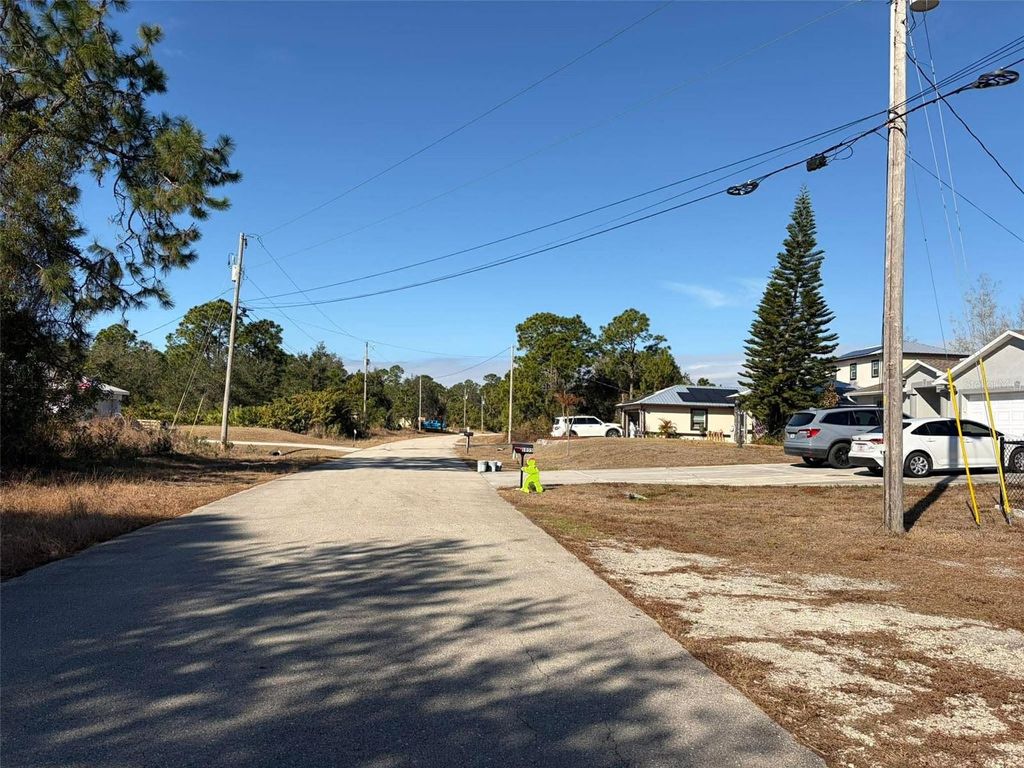 Photo of 1036 Pilgrim Street E, Lehigh Acres, FL 33974 (MLS # TB8475278)