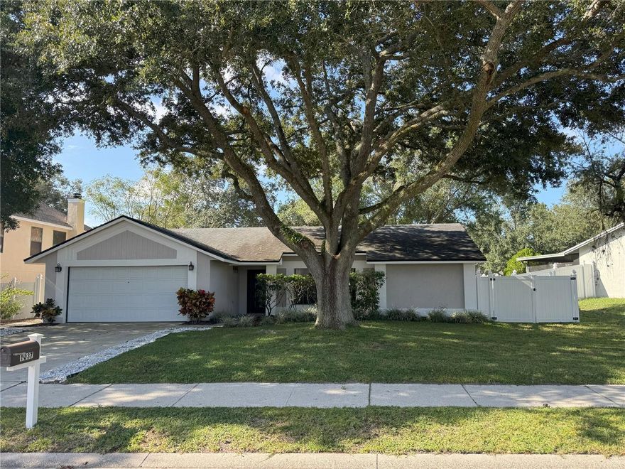 Don’t you dare snooze on this gem of a 3/2 in sought after Alafaya Woods!  Majestic trees are basically waving at you as you pull up to this updated beauty. Out back? A fully fenced yard wrapping around a fire pit—perfect for roasting marshmallows or some hot dogs.  Inside, the bathrooms sparkle with updates, the floors are fresh, and the split floor plan means you can hide from your faimily/roommates/partner when needed. You’ve got not just a formal living room (for when you want to act fancy) but also a cozy family room with a wood-burning fireplace.  Top it off with an indoor laundry room (no more laundromat life), a 2-car garage (your cars will thank you), and—drumroll—all appliances stay! Yep, fridge included. All you need to do is pack your things and MOVE IN