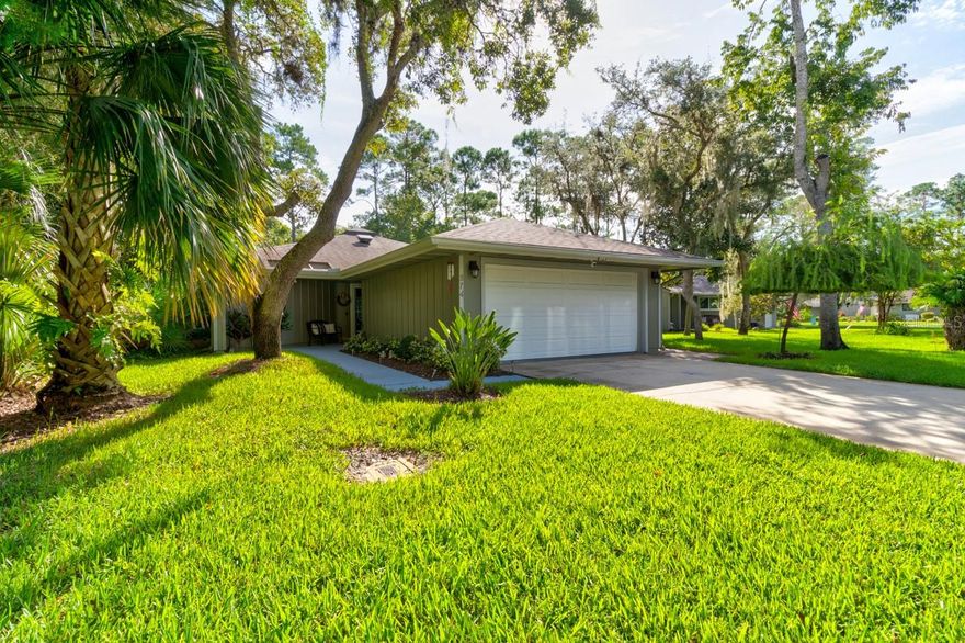 A true beauty in prestigious Sugar Mill Country Club. Lawn maintenance is included with the hoa fee in the Brae Burn community which has a community pool. This home features 2 bedrooms, 2 updated bathrooms, an updated kitchen, soaring ceilings in the living area and a peaceful nature setting. There is also a large screened in patio as well as a patio with a grill and hot tub. The home shows like a model and is being sold fully furnished! No issues during the hurricanes......hurricane protection in the garage for all windows! ;Water: City