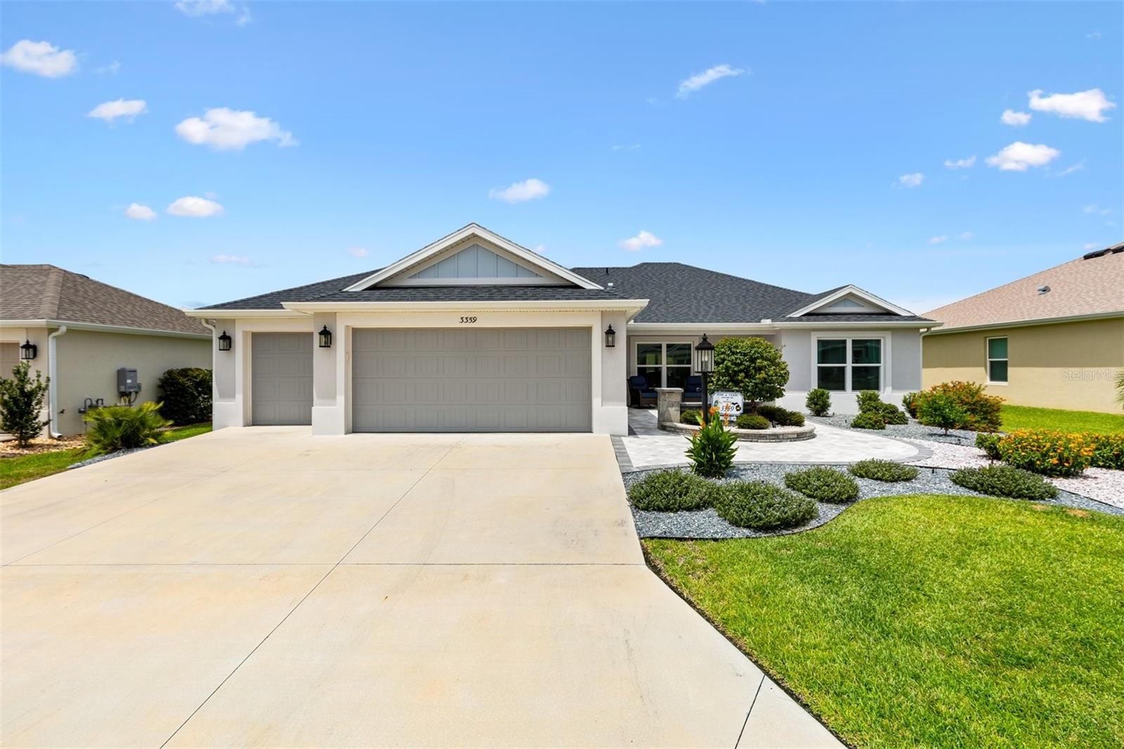 This picture perfect expanded Alder model won't last long! This Designer block home with a 2 car plus a GOLF CART garage boasts of an island kitchen, living room, dining room and a spacious den that opens to a screened lanai for relaxing and entertaining. This 3 bedroom 2 bath home has a split plan with privacy for your guests on one side and your privacy on the other. The primary bedroom has his and her closets, duel sinks and a beautiful walk in shower with glass enclosure. Spacious indoor laundry room that leads to the 2 car + Golf cart garage that is accented with an epoxy floor and a water filtration system.Gutters have been intalled around the entire home. All this set on a beautiful landscaped lot with a large outdoor paver patio in the front ideal for morning coffee or evening chats. Only steps to the DeLuna pool surrounded by pickleball courts, shuffleboard, bocce ball and walking paths. Minutes from Brownwood town square, Everglades recreation, Water Lilly, Ednas on the Green, Middleton and soon to open Eastport town square.Plenty of shopping Publix, Walmart and more.