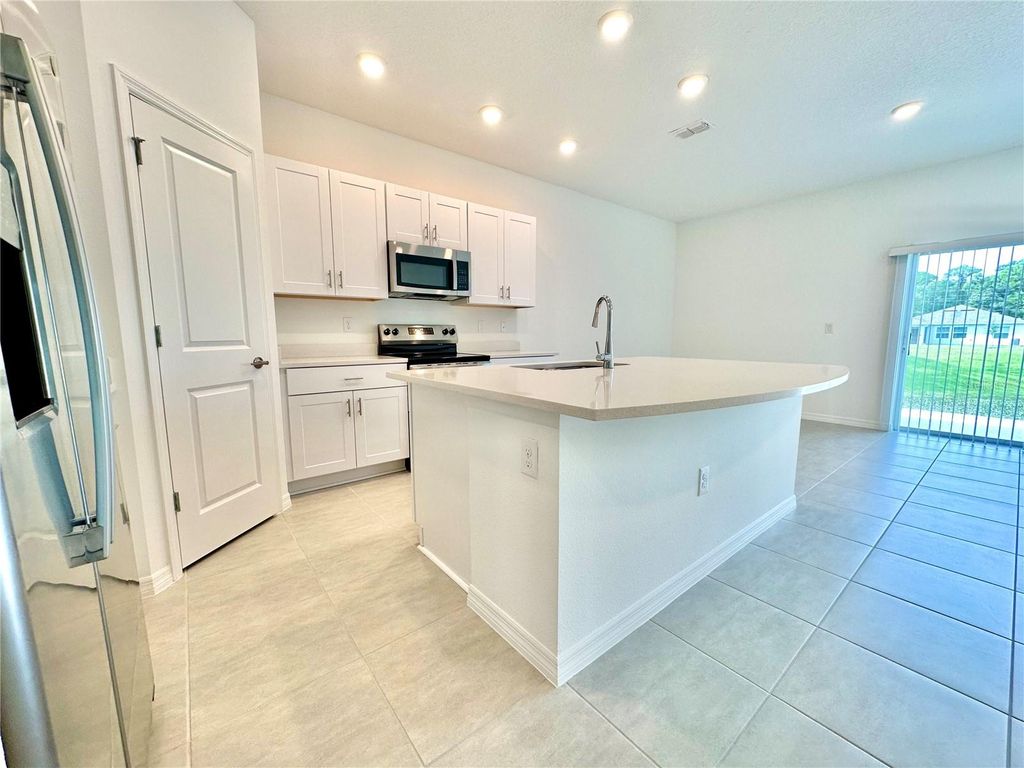 Photo of 173 River Front Way, Edgewater, FL 32141 (MLS # O6349564)