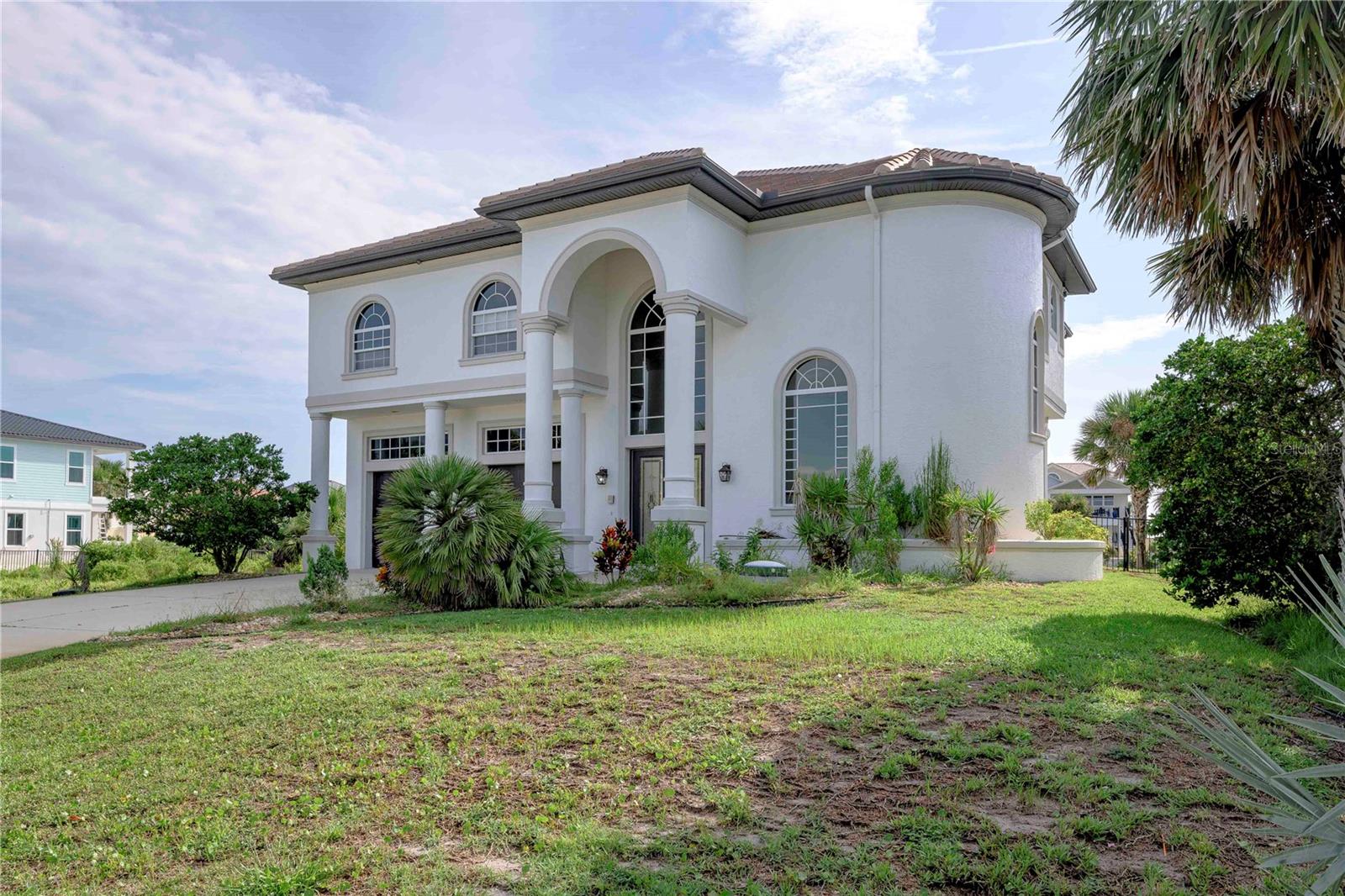 Coastal living at its finest! 3 bed, 3.5 bath waterfront home has a first floor view of the lake and sweeping 2nd floor ocean views. the entry is a fabulous circular staircast so inviting to all who enter. First floor has an expansive living room and wet bar for entertaining, with dual french doors to bring the outside in. Upstairs a huge family room/kitchen combo with a gas fireplace provide a grand space for entertaining while looking at the ocean. The home boasts a large master suit also with ocean views.This is a must see property. The community has a pool for gathering and this property has the space to allow a private pool/spa experience of its own.