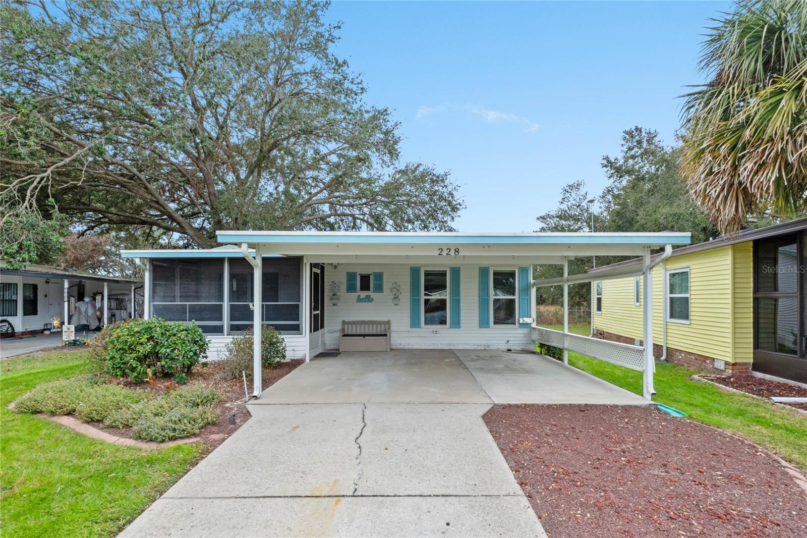 Stunning remodeled home with GORGEOUS BACKYARD private retreat. UNBELIEVABLE LOW HOA of only $255 month for the abundant number of amenities in the highly desired 55+guarded 24/7 community of Pennbrooke Fairways noted for their well maintained golf courses and 10 minutes from The Villages nightly entertainment, shopping and dining! Feel the serenity the moment you pull into your double carport, perfectly situated on a friendly cul-de-sac. Step into your roomy sunroom, flowing naturally into a cheerful and light-filled living area. This home can be bought furnished or unfurnished! Numerous upgrades can be seen throughout the home featuring new windows (2023), Newer roof (2020), New water heater (2024) and luxury vinyl plank flooring. The attractive kitchen was remodeled in 2022 with leathered fantasy countertops, stainless steel appliances and new cabinets. Perfect area to entertain is your dining area conveniently located next to the kitchen with its beautiful decorative lighting. This home offers over 1500 SF when you include the office/sewing room and spacious laundry room conveniently located off the kitchen. No expense was spared in adding custom cabinetry to the office and laundry area, complete with generous folding space. Two spacious bedrooms and 2 bathrooms that were gutted and replaced with modern upscale fixtures. Before hitting the bed after a long day, enjoy the rare find in this community which is your backyard private sanctuary complete with butterflies and birds. Host unforgettable evenings around your large fire pit, shaded by majestic oak trees and backed by peaceful privacy with no rear neighbors. Show off your man/cave or workshop shed attached to the back of the home. Your low HOA of $255 month includes cable, internet, lawn cutting, 24/7 guarded gate along with all the incredible amenities. Pennbrooke offers RV and Boat Storage for FREE along with dump and wash stations. The community center offers a restaurant, golf pro shop, hair salon, library and puzzle room. Indulge in all the clubs and activities at the recreation center along with the pools, pickleball, tennis, shuffleboard, fitness center, library, puzzle room, billiards, bocce ball courts, corn hole, horseshoe pits, softball field, memorial garden, stocked fishing ponds, and much more. Pennbrooke offers golfers two executive nines and one regulation nine, all at very reasonable rates. Where else can you live this lifestyle in such an amazing community, minutes from The Villages and the growing Downtown Leesburg area for an INCREDIBLE $255 MONTH HOA FEE! Book your appointment now to see this one before it gone!
