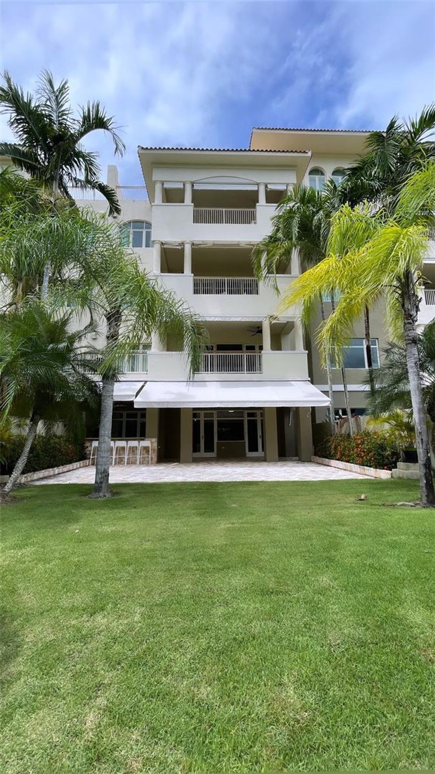 Located within the gated community of Plantation Village inside Dorado Beach Resort Residences, this fully renovated penthouse offers a refined blend of modern elegance, comfort, and resort-style living. Spanning approximately 2,074 square feet, including its spacious balcony, the residence features an open-concept design that seamlessly connects the kitchen, dining, and living areas. Natural light fills the interiors and extends onto an expansive terrace overlooking the Sugarcane Golf Course, creating a serene setting ideal for entertaining or enjoying Dorado’s spectacular sunsets. The property offers three spacious ensuite bedrooms, three and a half bathrooms, a walk-in closet in the primary suite, and a dedicated laundry area. Designed with both style and functionality in mind, the residence includes high-end finishes and top-of-the-line appliances, providing a move-in ready opportunity. The penthouse includes two covered parking spaces with a private storage area, additional parking for a golf cart, and one exterior parking space for added convenience. Residents enjoy 24/7 private security, a full backup generator, and a water cistern, ensuring uninterrupted comfort and peace of mind. As part of the Dorado Beach lifestyle, residents benefit from access to direct beach entry, championship golf courses, tennis and basketball courts, Watermill Water Park, the Ritz-Carlton Reserve, and Encanto Beach Club & Spa. Conveniently located near private schools, fine dining, medical facilities, and premium grocery stores, this penthouse represents luxury living in Dorado Beach.