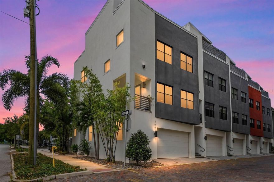 Step into luxury living with this stunning end-unit townhouse in the heart of vibrant Downtown St. Petersburg. Boasting 3 bedrooms, 3.5 baths, an expansive rooftop deck, and an impressive 2,653 square feet of thoughtfully designed living space, this modern gem combines high-end finishes with a lifestyle of ultimate convenience and style.
The first floor features a spacious bedroom with ample closet space, an en suite bath, and abundant natural light. Whether you envision a private guest suite, a professional office with street access, or a personal gym, this versatile space adapts to your needs.
On the second floor, you're greeted by an open-concept living area designed for both relaxation and entertaining. The sleek kitchen is a chef’s dream, complete with a gas range, quartz countertops, stainless steel appliances, and soft-close wood cabinetry. The adjoining dining and living areas are bathed in natural light, showcasing 10-foot ceilings, custom window treatments, and a cozy balcony. A convenient powder room enhances this level.
The third floor is your personal retreat, featuring an exceptional owner’s suite with three custom walk-in closets and an opulent en suite bath, including a freestanding soaking tub, dual vanities, a private water closet, and a seamless glass-enclosed walk-in shower. A second bright and airy bedroom on this floor also includes a walk-in closet and private en suite bath, with a laundry closet conveniently nearby.
The crown jewel of this home awaits on the fourth floor: a rooftop terrace designed to impress. Entertain effortlessly with a wet bar, a beverage fridge, and floating shelves at the top of the staircase. Then, step out onto a spacious composite deck equipped with a remote-controlled retractable awning, power outlets for a TV, water access for a customizable outdoor kitchen, artificial turf for added flair, and panoramic downtown views. This space is a true urban oasis.
Adjacent to a city park and steps from USF’s campus, this location is unbeatable. You're just three blocks from the waterfront and within walking distance of Beach Drive's shopping and dining, the St. Pete Pier, and the Dali Museum. This is more than a home—it’s a lifestyle. Live, work, and play in the heart of one of Florida’s most exciting cities! Schedule your private showing today.