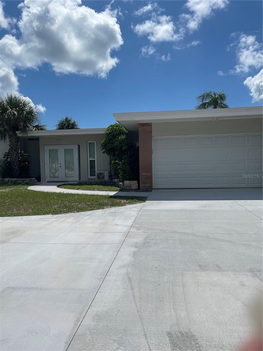 Beautiful location and amazing single family home. 3 bedrooms, 3 bathrooms and a bonus room. It is fully furnished, with an updated kitchen with stainless appliance. There is plank flooring in the entire home and updated bathrooms. This is a split floorplan property with the master bedroom on the right hand side the other bedrooms are on the opposite side of the home. The main bathroom situated in the hall, separates the bedrooms. There is a unique breezeway at the entrance, that leads to the main house, the bonus room or the massive entertainment area outside.