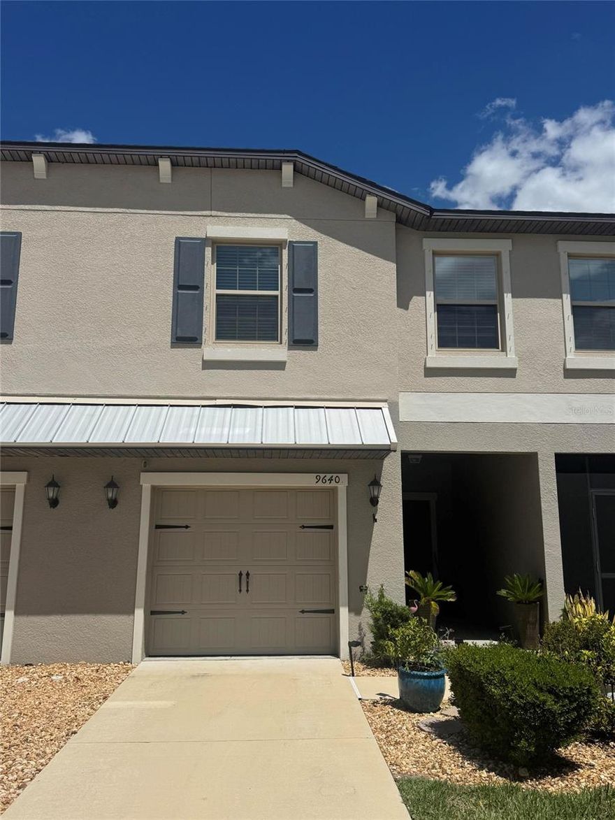 This modern, well-maintained townhouse provides an open-concept layout and a neutral palette, making it move-in ready.

Interior & Upgrades
* Modern Kitchen: Light cabinetry, granite countertops, and a breakfast bar. Equipped with a full suite of GE stainless steel appliances.
* Spacious Living Spaces: High ceilings and recessed lighting on the first floor. Upstairs includes a versatile loft area for a home office or reading nook.
* Owner’s Suite: Large master bedroom with plenty of space for a king-size bed and additional seating.
* Attached Garage: Features a pre-installed Tesla Level 2 Wall Connector for convenient EV charging.
* Updated Lighting: New modern ceiling fans and light fixtures installed throughout the main floor.
Outdoor & Community
* Low Maintenance Living: Monthly HOA fees cover high-speed internet, cable TV, professional lawn care, and exterior maintenance.
* Screened Lanai: Private outdoor space at the back of the home with views of the natural greenery.
* Community Amenities: Access to the community pool is included, located just a short walk from the property.
* Location: Quiet neighborhood with easy access to Sun City Center shopping, dining, and local services.
