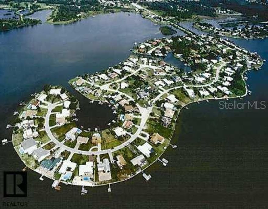 An ISLAND, a NEIGHBORHOOD, a LIFESTYLE!!  Join this elite conclave of homes situated in northern Pinellas County, surrounded by the Gulf & serene waters of St. Joseph Sound.  INDIAN BLUFF ISLAND is an address with prestige!  Offering a 'coastal' way of life, launch your stand-up boards & kayaks from the causeway & drift into a paddler's paradise or keep your boat or jet skis on your property under your personnel, hidden covered parking.  Sip your favorite drinks as you appreciate amazing sunsets over the water views to the west or wake up with 'your cup of joe' watching the splendor of the sunrise from your private patio.  This 4 bedroom, 2 bath home offers an open concept design & spacious room sizes; the kitchen shines with all new energy efficient appliances; AC is new with enhanced HVAC UV & electronic filtration; upgrades of crown moulding, granite counter tops throughout, barn doors & new luxury, vinyl flooring complete the package.  Salt water pool with child safety fence is nestled in the vast, fenced yard, surrounded by paver decking & covered screen porch.  Roof is brand new!  Yard is landscaped with FL friendly plants using non-toxic pesticides.  Circular drive provides ample guest parking; hidden side yard covered parking & pad allow for keeping boats, RV's & other toys!  Quiet, ideal location close to all amenities, golf courses, beaches, Pinellas Trail, Wall Springs Park, Palm Harbor schools, medical/hospitals.  Enjoy the benefits of Island living!!