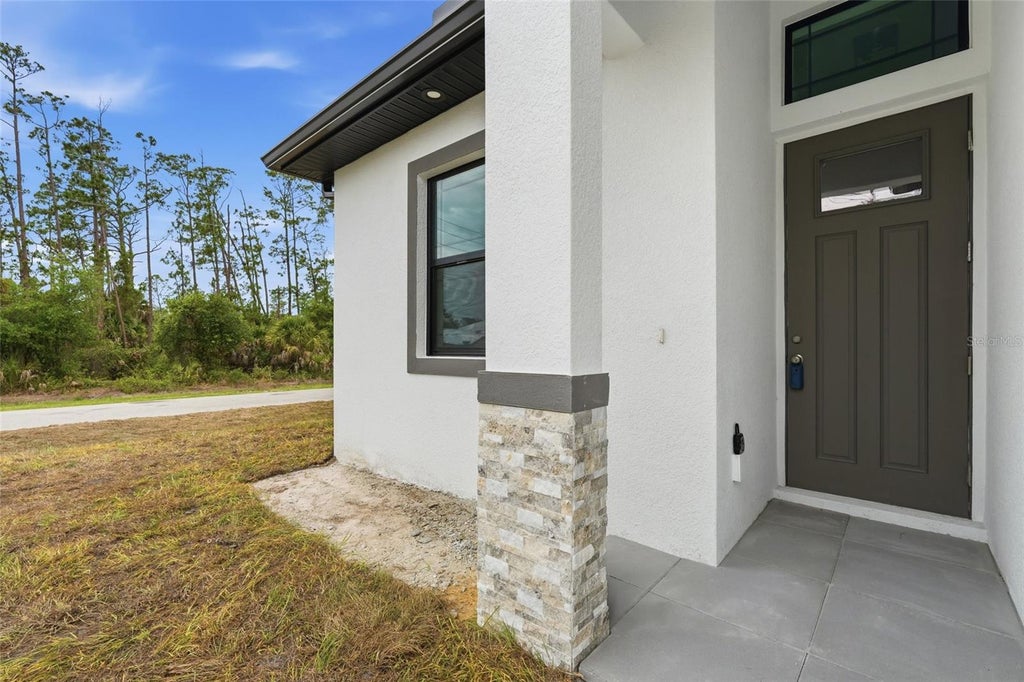 Photo of 15144 Faulkner Avenue, Port Charlotte, FL 33953 (MLS # C7526350)