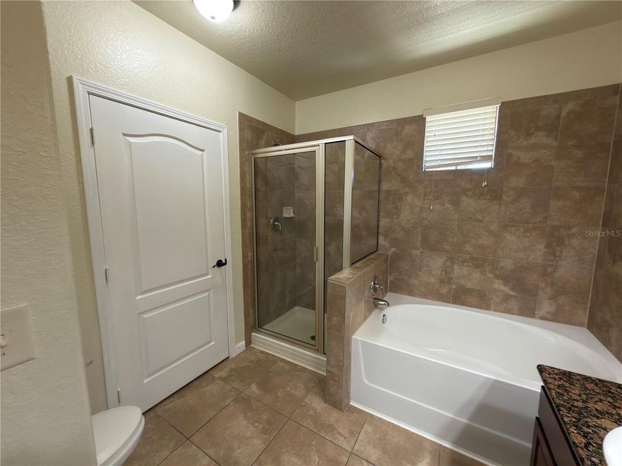 Walking distance to dining, groceries and shopping at Berry Town Center and just a short drive from Disney and all the Central Florida attractions this 3-bedroom, 3-bathroom condominium is ideally located. Well-kept 2nd floor unit! This home offers 3 bedrooms and 3 full baths. Fully equipped kitchen with granite counters. Tile flooring in the wet and main living areas. New Carpeting in the bedrooms. Access the unit via elevator or stairs. The neighborhood has a community pool, fitness and clubhouse.