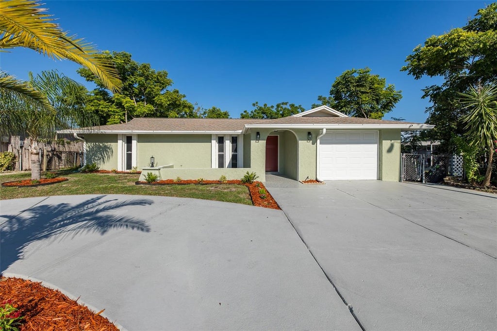 Photo of 11611 Newell Drive, Port Richey, FL 34668 (MLS # TB8548467)