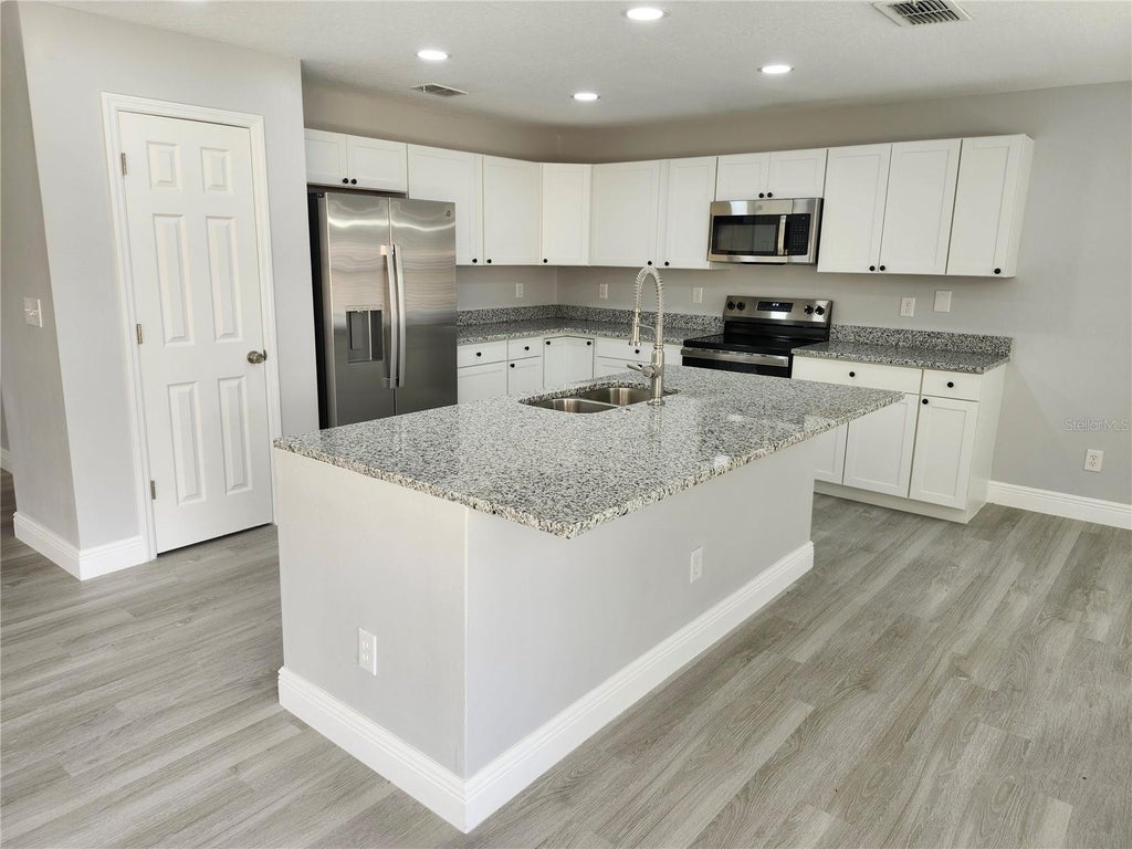 Photo of 3069 Tobago Avenue, Clermont, FL 34711 (MLS # O6452076)