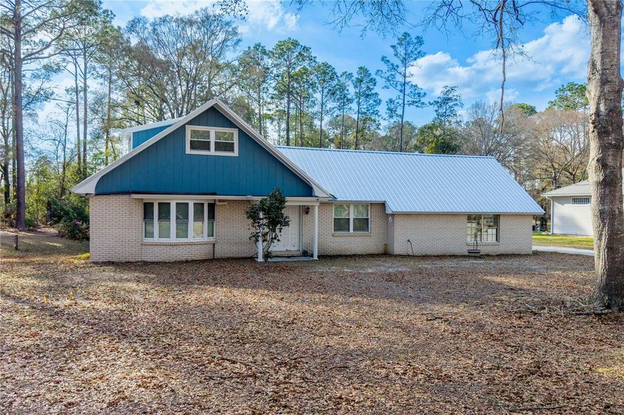 Sellers are motivated!! This 2 story, 4-bedroom, 2-bath home is nestled near the Starke Golf & Country Club. With a two-year-old metal roof, windows installed in May 2024, water heater replaced in 2021, many big-ticket items are already in place. In addition there is a bathroom on each floor, attached garage and a fenced area for pets. Outdoors, you'll find a spacious lot with mature trees—offering both shade and charm. Inside, the home is a blank canvas awaiting your personal touch and vision. A great opportunity to create the home you've been dreaming of! Easy commute from Gainesville or Jacksonville.