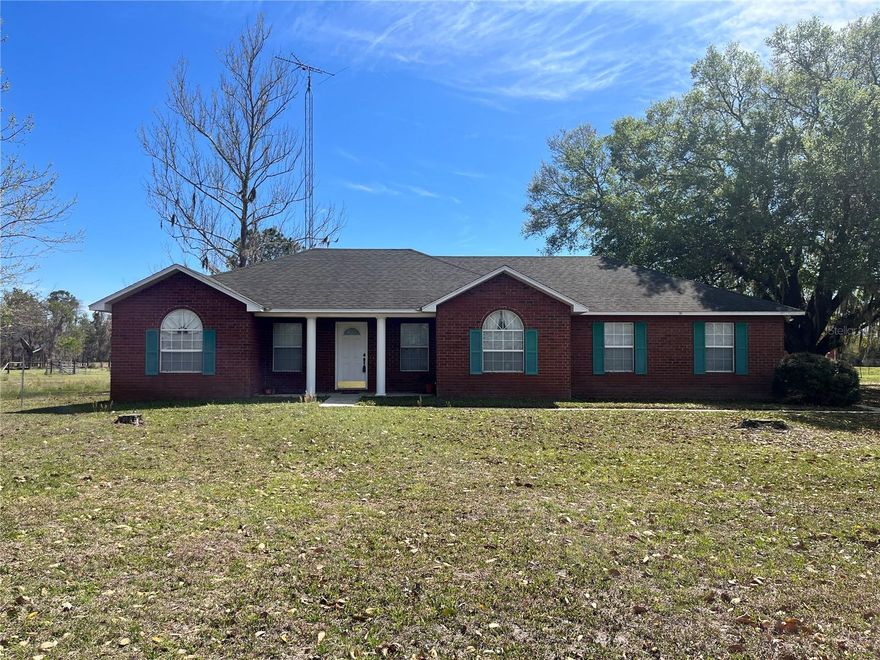 All brick home on 38.94 cattle ready acres.   Fenced and cross fenced, paved road frontage.   Home features include vaulted ceiling in living room, split bedroom arrangement, tub and separate shower in primary bath, attached 2 car garage with opener.   Laundry in garage.