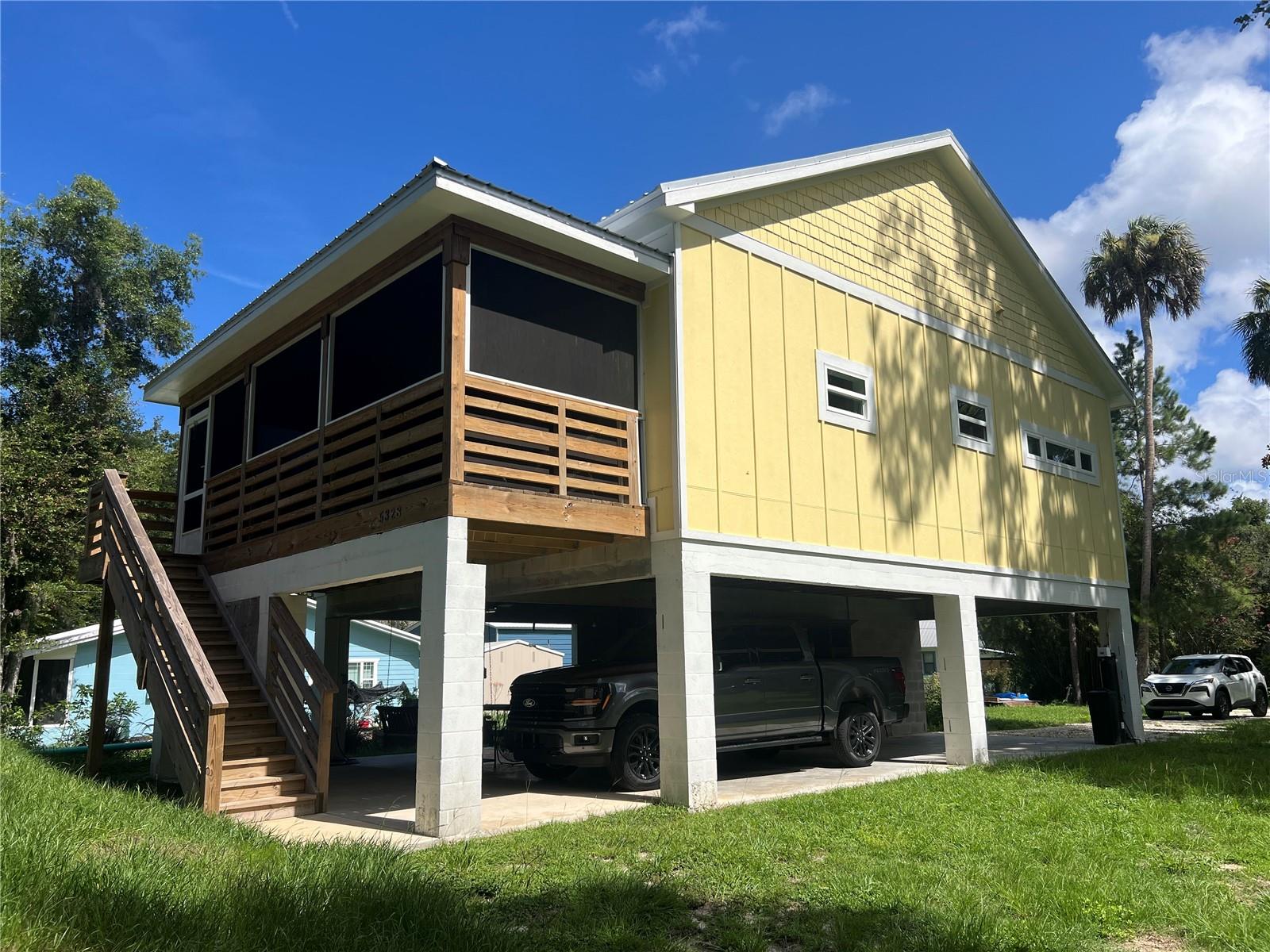 BUILDERS PERSONAL HOME!! No expense was spared in the construction of this absolutely CHARMING 2023 stilt home! Located on one of the most desired streets in all if Yankeetown, Historic Riverside Drive! Boat ramp, restaurants, festivals, fishing, just right down the road! Such an enjoyable area to take a walk, chat with the locals, and take in the beauty of the nature that surrounds you! Enjoy your morning coffee on the inviting screened-in porch, the epitome of Southern Charm! Step into the home and you'll be amazed at all the attention to detail. Painted shiplap walls and stained wood ceilings, beautiful cabinetry, Quartz, countertops, under cabinet lighting, pantry, stainless appliances and vent hood. Both bathrooms feature, custom tile and quartz countertops. Luxury Vinyl Plank flooring in living areas and bedrooms. Outside you'll find a large covered "hangout" space that was pre-plumbed for and outdoor kitchen. Enclosed area for storage and mechanical equipment also has an extra washer and dryer hook up and is also plumbed for a shower, sink and toilet, so you could easily add a 3rd bathroom. This stilt home design also offers covered parking. 50-amp hook-up for RV or generator. Home is used as a profitable vacation rental when not in use by the owner...nothing but rave reviews! Whether you're looking for a great investment or a new place to call home, this one will not disappoint!
