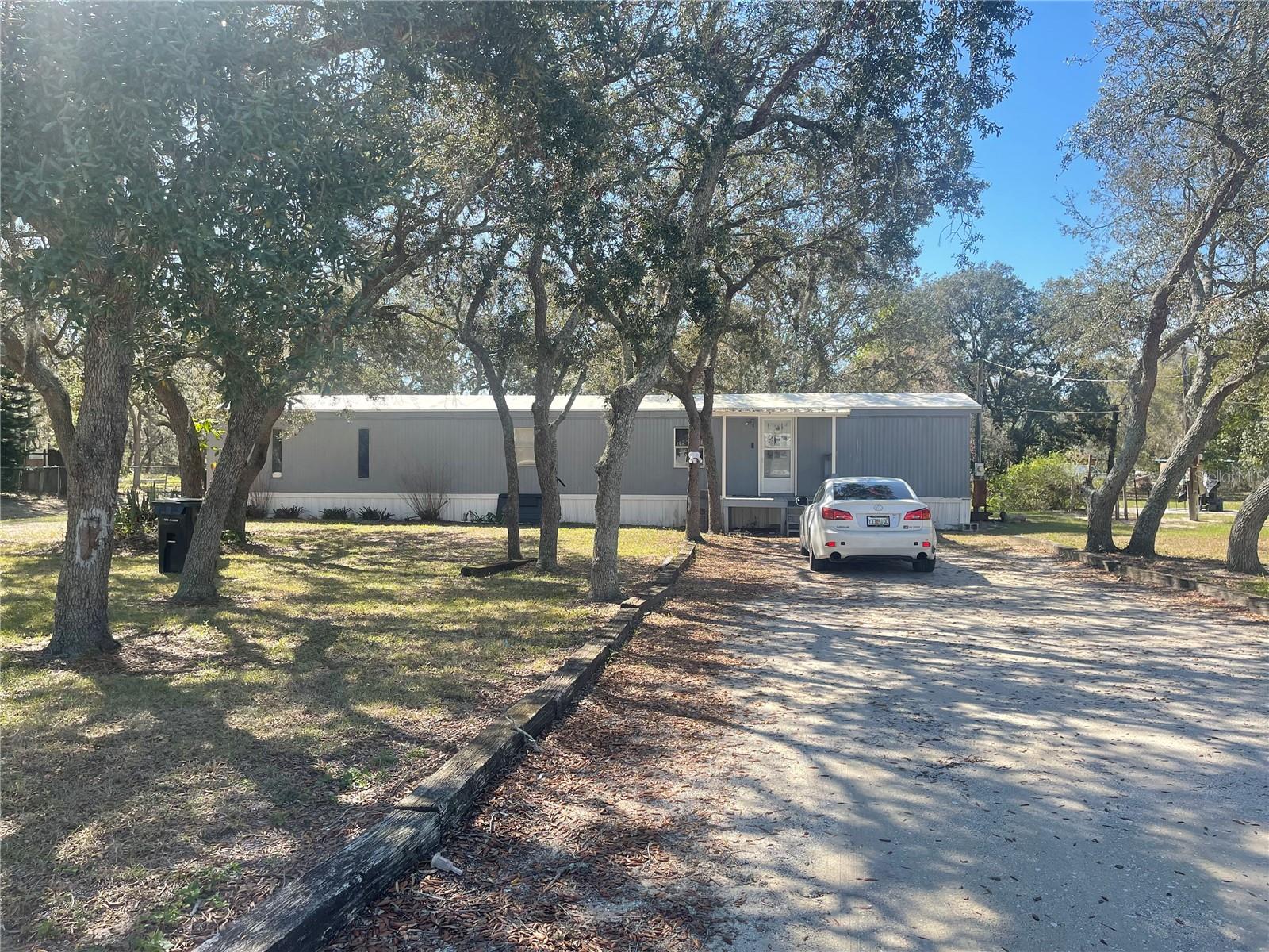 FL living at an affordable price or great investment property! This 2BD/2BA home is situated on 0.50 acres. Short distance to all shopping, schools, medical facilities, and restaurants. Make this your new winter retreat or year around home. Call today, don't miss this great investment opportunity.