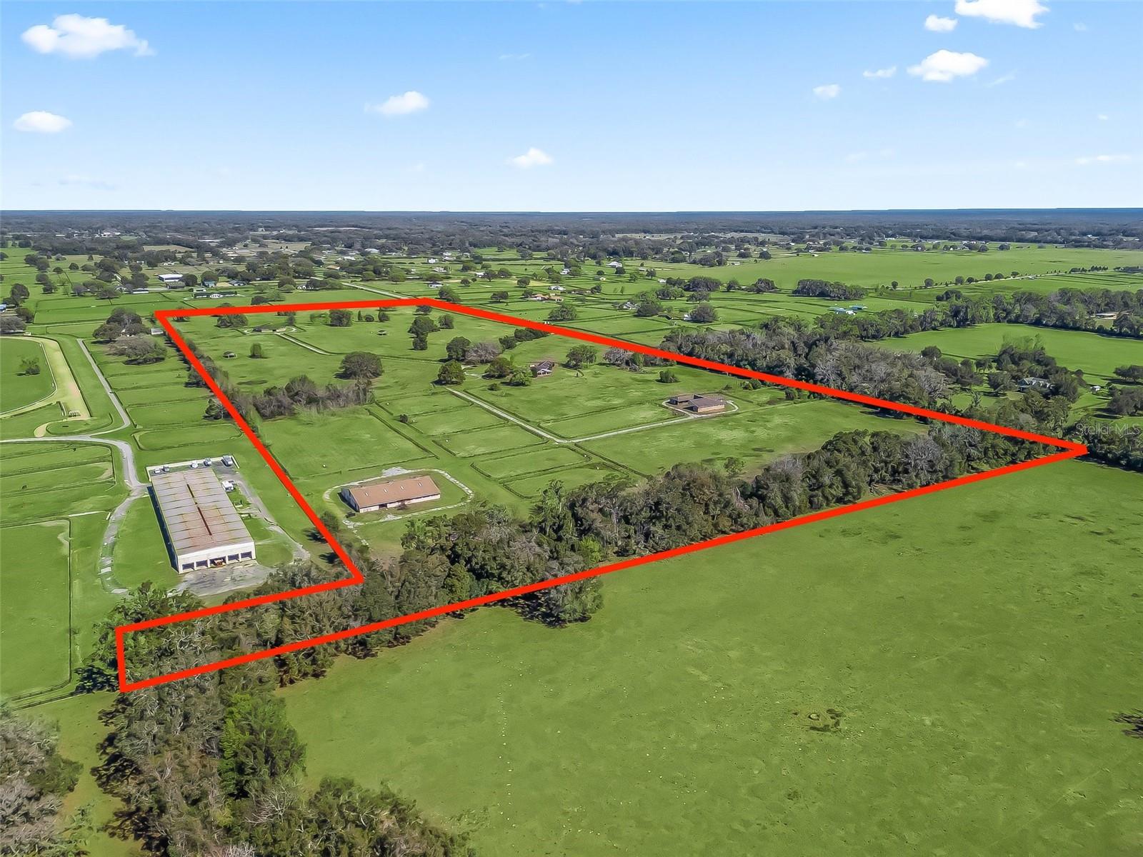 This 62.32-acre property in Cardinal Hill Complex is just 20 minutes from the World Equestrian Center and even closer to Downtown Ocala. The land features well-established trees and ample space, offering great potential for building your ideal farm or ranch. Situated near the Meadowlands subdivision known for its equestrian-friendly environment, providing access to scenic horseback riding trails that enhance the appeal of this location for equestrian enthusiasts.