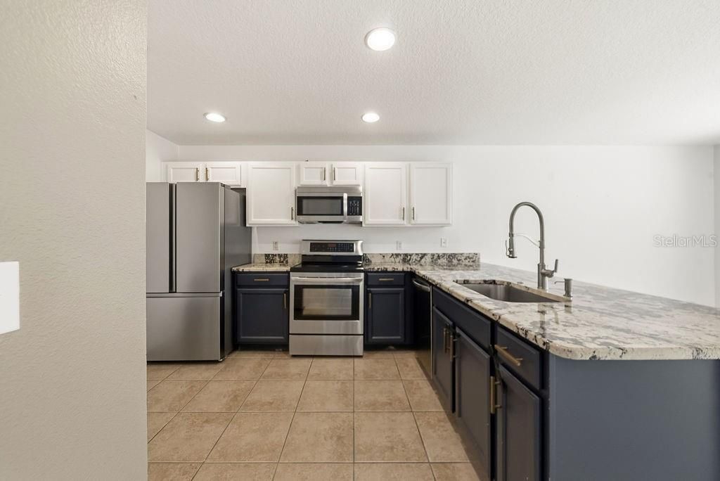 Photo of 13506 Tea Rose Way #112, Orlando, FL 32824 (MLS # O6418563)