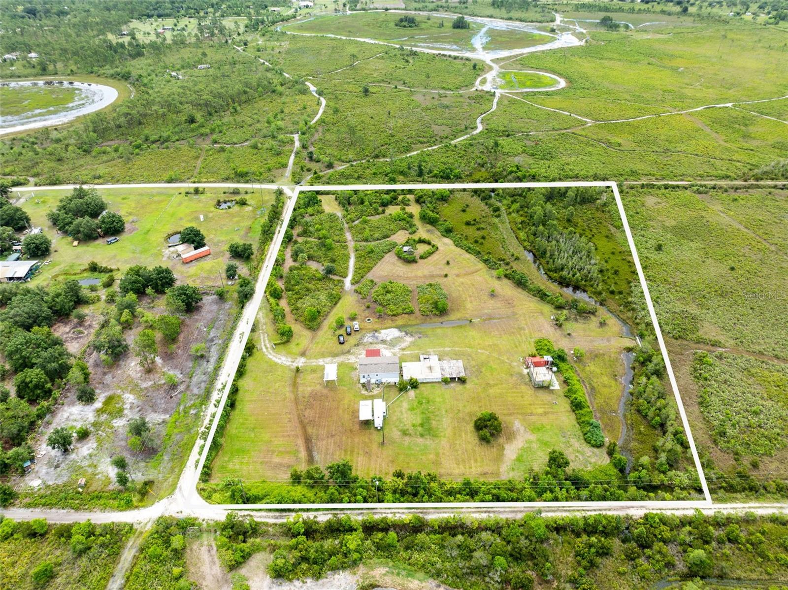 Escape to peaceful country living with this 2019 raised manufactured home nestled on 7.54 cleared acres of green, open land. This well-maintained home offers 2 spacious bedrooms and 2 full bathrooms, featuring beautiful vinyl flooring throughout and an open-concept layout connecting the living and dining areas for easy, comfortable living. Enjoy the benefits of a 2019-installed septic system and well, plus a water softener for added convenience. The property also includes a fully equipped RV hook-up with electric, water, and sewer connections—ideal for guests or extra flexibility.
You’ll experience the most beautiful sunsets, enjoy peaceful moments surrounded by nature, and embrace the tranquil lifestyle you’ve been looking for. Located just 9 minutes from Triple N Ranch Wildlife Management Area, where you can enjoy hunting, fishing, and exploring a network of well-maintained roads and trails—perfect for hiking, bicycling, wildlife viewing, and horseback riding. Plus, you're only 35 minutes from Melbourne Beach, offering the best of both country charm and coastal living.
Whether you're seeking space to grow or a serene escape, this property has it all.