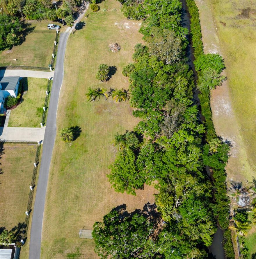 Discover this well maintained, peaceful property, tucked away in Tampa with direct access to Tampa Bay!  This waterfront lot is ready for your fishing boats and kayaks! Two adjacent lots being sold together total 1.25 Acre, accessible from a private road off Troydale Rd.  Enjoy living the Florida dream with this property, close to Tampa International Airport (6 miles) and shopping (.5 miles).