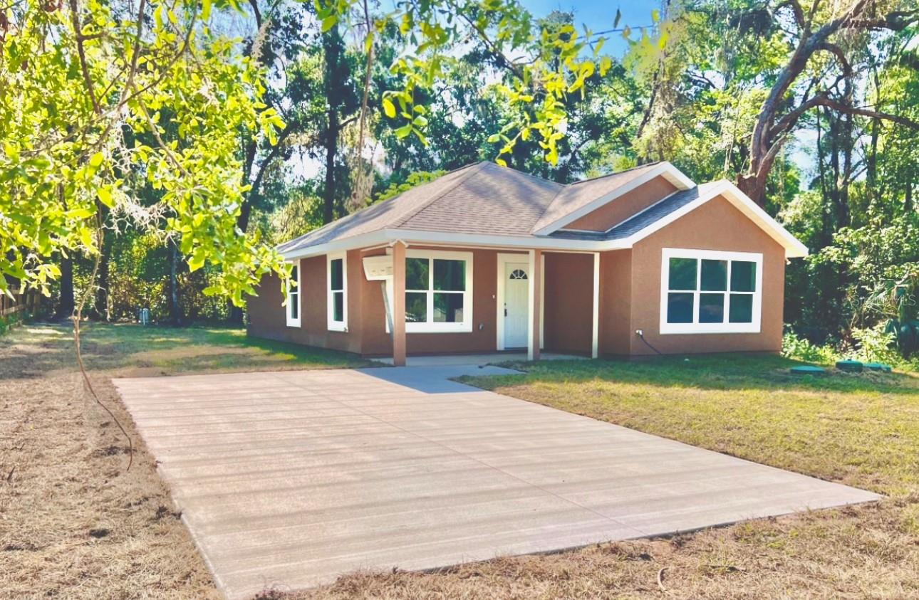 One or more photo(s) has been virtually staged. Under Construction. $5,000 Seller Credit to Buyer’s Closing Costs!
Step into style and comfort in this modern 2 bed, 2 bath, roomy 1200 square foot home with front and back patios for ample indoor-outdoor Florida living. Enjoy an open layout filled with natural light, luxury tile flooring, and a gourmet kitchen with bright, sparkling granite tile counters, stainless appliances, a large kitchen island, plus a sweet lazy Susan organizer. The spacious primary suite features dual sinks, a walk-in closet, with a separate tub and walk-in shower wrapped in granite tile. Sip coffee on the over-sized front patio or unwind on the peaceful back patio. Close to shopping, dining, and no HOA, this is a perfect blend of function and flair. Schedule your showing today!