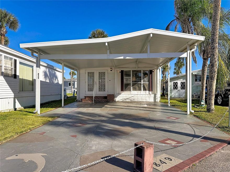 Welcoming curb appeal to this ONE LEVEL, 1 bed/ 1 bath home in the beautiful community of Outdoor Resorts!! HUGE double carport and decorative drive with parking for 2 vehicles plus a golf cart.  Home features: Attractive entrance with double doors welcome you into this fully furnished and equipped home with wonderful open plan layout; ROOF replaced 2020; WATER HEATER 2025; separate laundry area with single vanity and washer & dryer. Hardwood flooring in Family room & kitchen. This wonderful resort offers a 24/7 guard gated front entrance and private access to a 179 acre lake - beautiful Lake Davenport. Outdoor Resorts offers amenities such as 2 heated swimming pools, boat dock, golf course & 9 hole putt-putt golf, tennis, pickleball, a two story clubhouse for entertainment during various seasonal events & so much more....The Association fee is only $768.00 PER QUARTER! which includes all your amenities, in addition to Cable TV, Community heated pools, Park Manager, Mowing, Sewer, Water and Trash! Come and enjoy this fantastic, affordable lifestyle! Please remember 55+, no VA or FHA, 1 pet rule. The park benefits from being close to medical facilities, restaurants & grocery stores. Don’t delay!! Put this home on your ‘must see list’ and ask to arrange a viewing today! ****