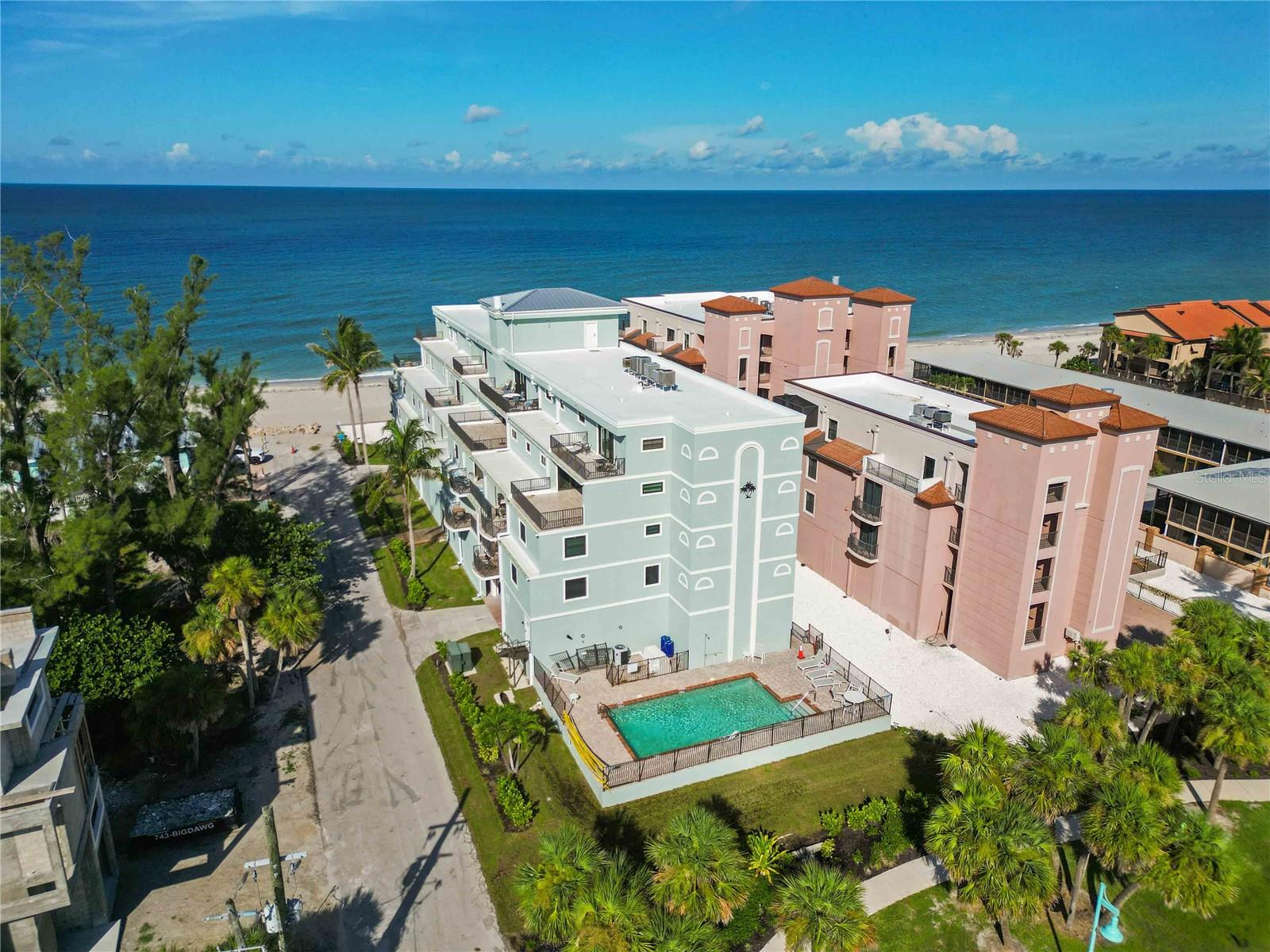 Elite Gulf-Front Luxury at The Palms on Manasota Key-Experience the pinnacle of coastal living in The Palms—an exclusive, impeccably maintained, 12-residence enclave tucked away on the private south end of Manasota Key. This exceptional 3-bedroom, 3-bath condominium offers 1,811 square feet of refined living space with captivating Gulf views from your balcony, just steps from the pristine sand and shimmering waters. Enjoy breathtaking sunsets over the Gulf each evening, then take a quick stroll to the lively beachfront roundabout, where boutique shops and multiple dining options await. FULLY FURNISHED with tasteful, high-quality beach-inspired décor, this move-in-ready retreat showcases an airy open floor plan, diagonal tile flooring, modern lighting, and a well-appointed kitchen featuring granite countertops, stainless steel appliances, abundant cabinetry, and a breakfast bar. The spacious master suite offers two closets, while the spa-like bath includes dual sinks, a walk-in shower, and a separate garden tub. Additional highlights include a private lanai, inside laundry, 2022 AC, new impact windows (2023), plantation shutters, and generous storage—both in-unit and in a dedicated storage closet just steps from the elevator for your beach and vacation gear. Positioned on the FIRST elevated floor for quick access to the parking garage, heated pool, and beach—whether via the central elevator or a short flight of stairs—this residence delivers both convenience and elegance. The Palms offers under-building assigned parking, ample guest parking, an outdoor shower, a beachfront entertainment area, and the peace of mind of a strong, healthy association. Recent enhancements include a new roof in 2025 and a multimillion-dollar remodel, leaving the building in pristine, like-new condition. Whether you’re seeking an exclusive winter getaway, a year-round residence, or a flexible investment with weekly rentals allowed, this home delivers the best of luxury, location, and lifestyle. Live where the beach is your backyard and every day feels like a vacation on one of Southwest Florida’s most beautiful stretches of shoreline. Ask your agent for the QR code to view floorplans, virtual walkthroughs, videos, and more.