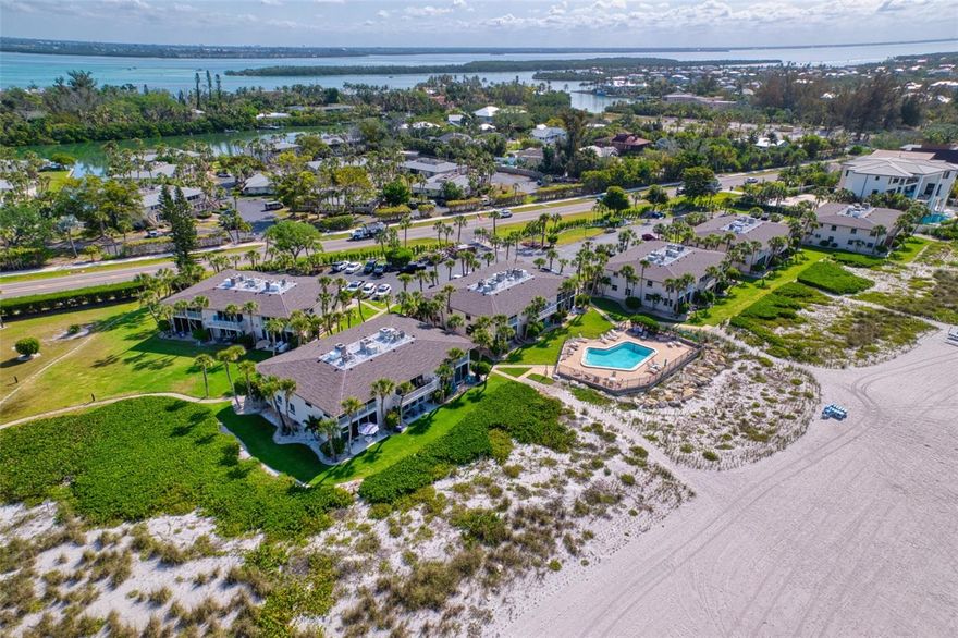 Finally, you have the opportunity to own your own "Walk-Out", Gulf Front, Beach Condo. Tucked just behind a beach grass sand dune and situated on a grassy knoll, this unit is perfectly positioned to benefit from refreshing sea breezes while offering spectacular sunset views. This rare one-bedroom condo has been completely remodeled and now features a unique two-bathroom floorplan. Remodeled Interior and Modern Upgrades:  The spacious living area boasts premium appliances and upgraded stone countertops on new cabinetry within a newly designed open kitchen. Updates abound throughout the unit: new hurricane impact resistant sliding doors and a front window, along with modern bathrooms. The property is being sold turn-key—everything stays, making it a seamless move-in experience.  Step inside and discover a bright, inviting interior with an open, light-filled layout designed to maximize both space and natural beauty. Large glass sliders connect the interior to the outdoors, bathing the kitchen and living area in sunlight and blending innovative functionality with coastal charm. The thoughtfully designed bedroom and bathrooms provide serene retreats, perfectly balancing comfort and style.  Private Outdoor Oasis:  The unique ground floor “Whitney Beach Gulfside” floorplan offers both a front privacy-fenced enclosed patio—ideal for alfresco dining or beachfront gardening—and a rear open patio for relaxation. Whether enjoying a quiet morning coffee or an evening cocktail, the gentle sea breeze creates the perfect setting for unwinding.  Resort-Style Community Amenities: Enhance your lifestyle with a range of well-maintained community amenities, including a sparkling pool, tennis courts, shuffleboard, beach chairs, boat slips available for lease, and a tranquil pavilion by the bayou for water enthusiasts. Unmatched Location and Lifestyle: Experience the best of coastal living on Longboat Key. Whitney Beach is located on the quiet, northern end of Longboat Key, close to fantastic restaurants, shops, and shopping—just steps away, an easy bike ride, or a short drive to visit St Armands Circle.
This condo combines a highly desirable location with the privacy and comfort of a casual beachfront lifestyle—perfect for year-round living, a seasonal retreat, or a smart investment. With one-month minimum rentals allowed up to 12 times per year, the property offers excellent investment potential. BONUS:  the community features two-story buildings and is exempt from Florida’s Milestone inspection and reporting requirements, ensuring a NO SURPRISE experience. Discover Longboat Key:  Enjoy the finest Longboat Key has to offer, where luxury meets laid-back coastal charm. Schedule your private tour today!