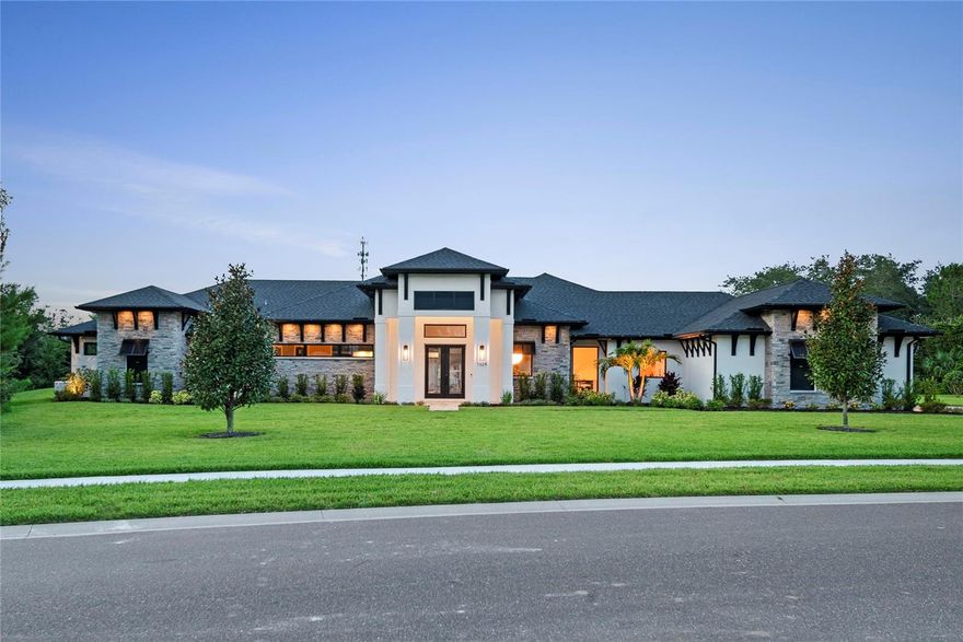 Under contract-accepting backup offers. Fall in Love with Elevated Coastal Living

Welcome to a place where timeless elegance and coastal serenity come together in perfect harmony. Nestled within the exclusive gated enclave of Turnbull Crossings in charming New Smyrna Beach, this newly built 4,752-square-foot luxury estate is more than a home—it’s a heartfelt escape. Set on a lush, private 1-acre lot, this masterpiece was designed for those who dream of refined living with a touch of magic and is MOVE-IN READY and includes furniture!

Inside, every detail speaks the language of love and craftsmanship. Four spacious bedrooms and three and a half beautifully designed baths provide room to grow, rest, and reconnect. A detached one-bedroom, one-bath casita offers the perfect retreat for guests or quiet moments of your own.

Artisan cabinetry and rich Azure Reserve Versailles White Oak floors flow throughout the home, lending warmth and sophistication. The heart of the home—a chef’s kitchen straight out of a dream—features custom cabinetry, quartz countertops, and top-tier Monogram appliances all centered around a quartz waterfall island perfect for everything from casual breakfasts to candlelit dinners.

Each bathroom is a sanctuary, adorned with exquisite James Martin vanities and spa-inspired finishes that turn daily rituals into luxurious experiences.

Designed for connection and celebration, the home boasts curated entertainment spaces, including a game room bar with a built-in beverage fridge and a formal dining room bar with a glass-front refrigerator and a premium Perlick ice maker. Whether you're toasting under soft lighting or hosting cherished gatherings, every detail is designed to delight.

Step outside into your private resort paradise. A screened 15' x 42' saltwater pool glistens beneath the sky, complete with a soothing 6' x 6' spa, inviting swim-out shelf, and PebbleTec finish. The surrounding sandblasted marble deck and fully equipped summer kitchen—with gas grill and outdoor fridge—create a picture-perfect backdrop for unforgettable evenings under the stars.

This home also offers peace of mind and lasting comfort with state-of-the-art systems, including a 500-gallon underground propane tank, 24 kW whole-home generator, whole-house water purification, high-efficiency Carrier HVAC, and energy-smart features throughout.

An oversized 822-square-foot garage and an expansive 1,112-square-foot lanai extend your space for life and leisure.

Just 20 minutes from the waves of the Atlantic, you’ll be close to the charm of Flagler Avenue’s boutiques and restaurants, world-class golf, the Indian River’s sparkling waters, and the thrill of Daytona International Speedway—all with the enchantment of Orlando’s theme parks only an hour away.

This is more than a luxury estate. It’s a sanctuary for the soul—a place to fall in love with life, over and over again.